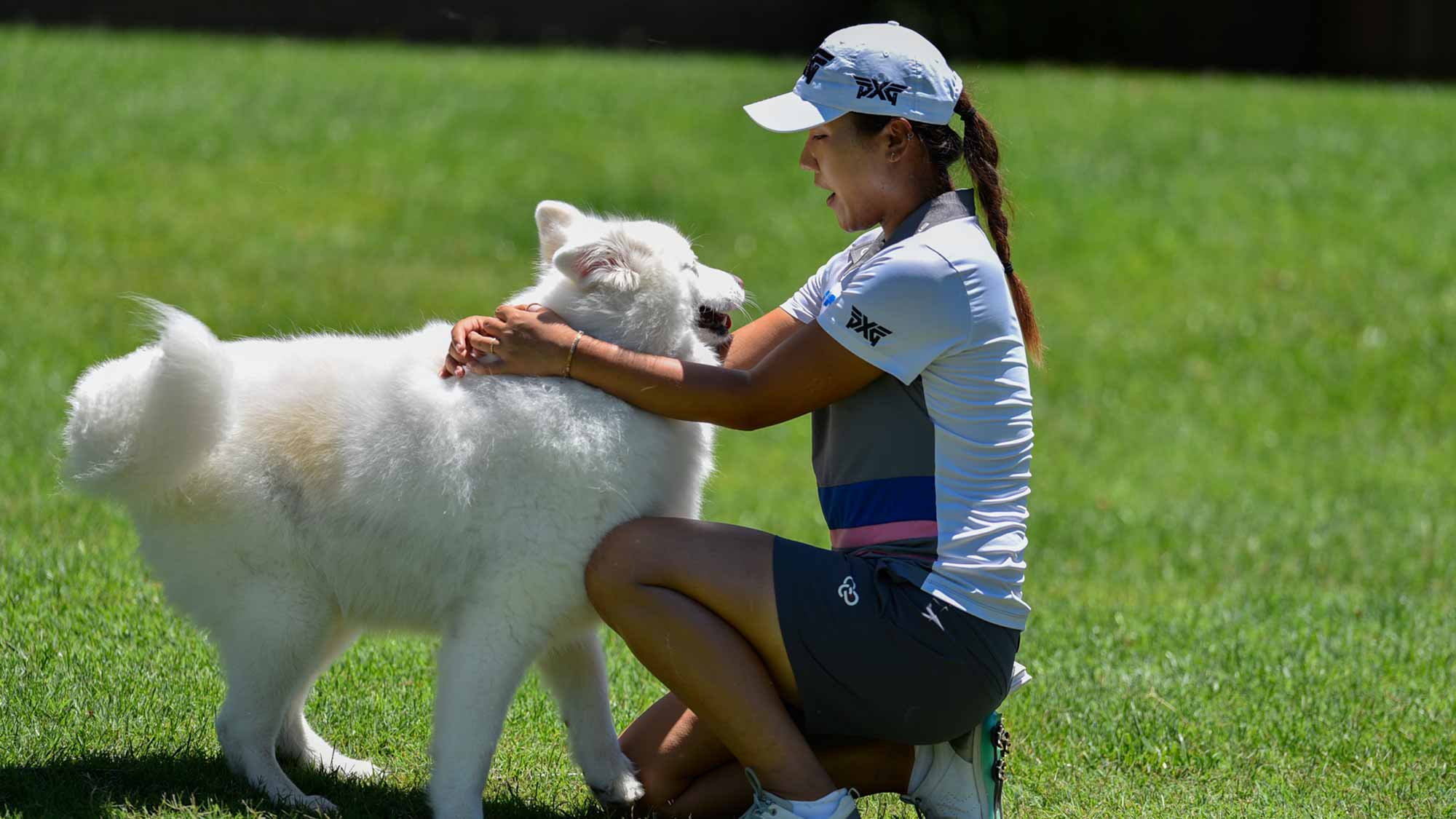 Defending champion Lydia Ko makes friends with a dog on-site at the 2017 Walmart NW Arkansas Championship Presented by P&G