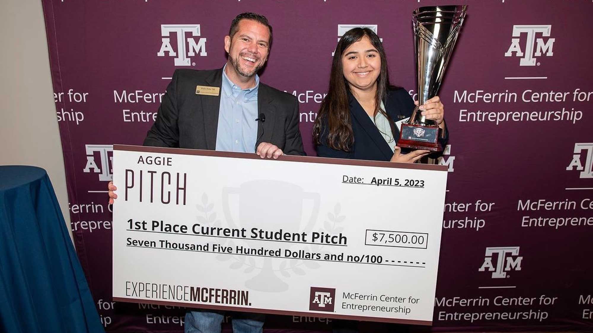 Katie Calderon with check and trophy