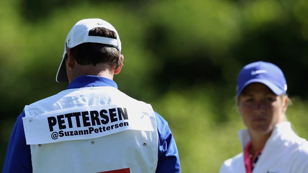 Suzann Pettersen's twitter handle is seen on her caddie Terry MacNamara's bib during the first round of the 2012 Wegmans LPGA Championship