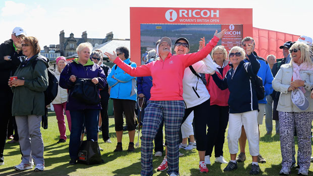 Players and fans have some fun during a delay at the RICOH Women's British Open