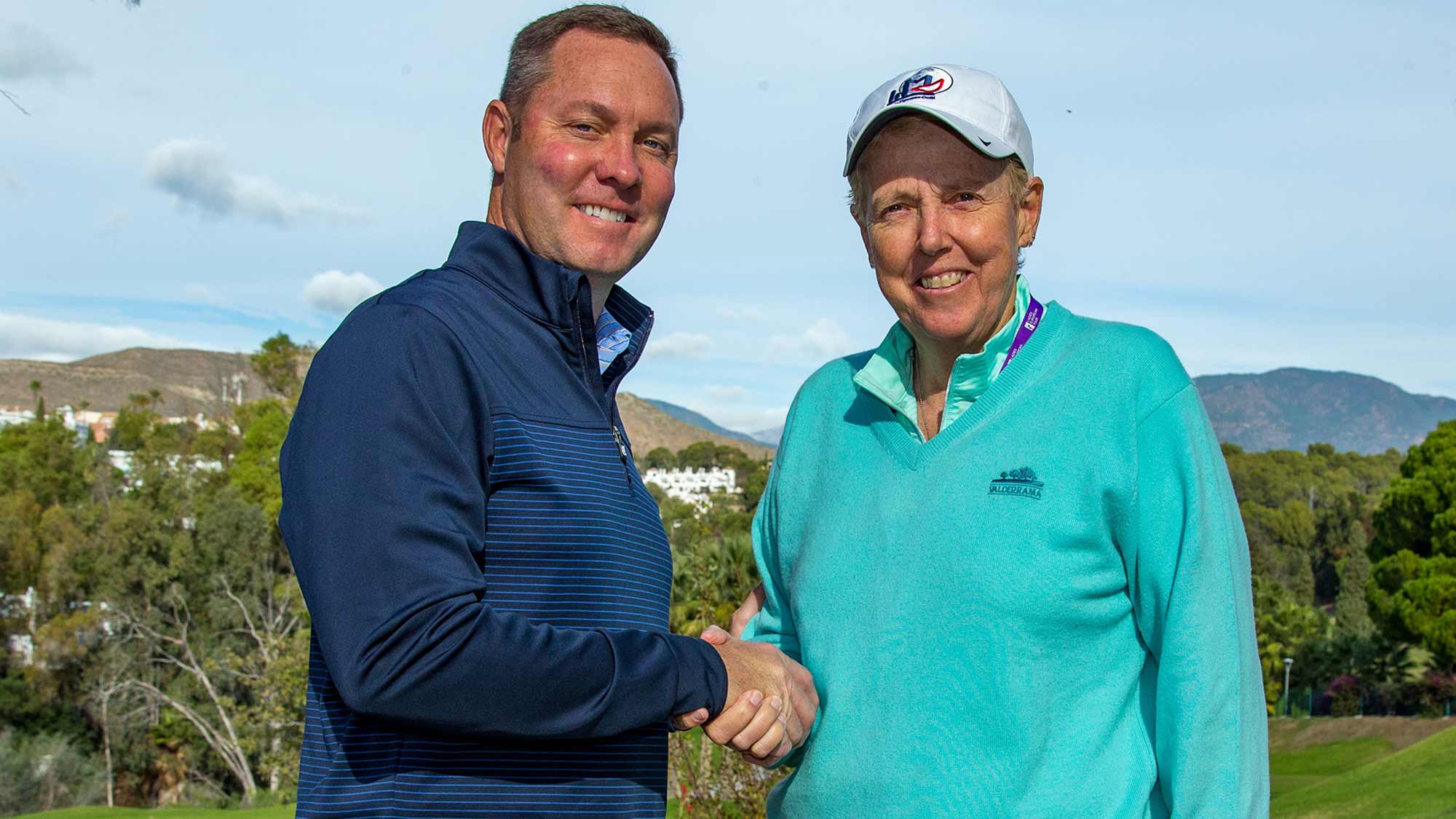 LPGA Commissioner Mike Whan and the Ladies European Tour's Board Chair Marta Figueras-Dotti shake hands on Tuesday following the LET's Annual Membership Meeting in Spain