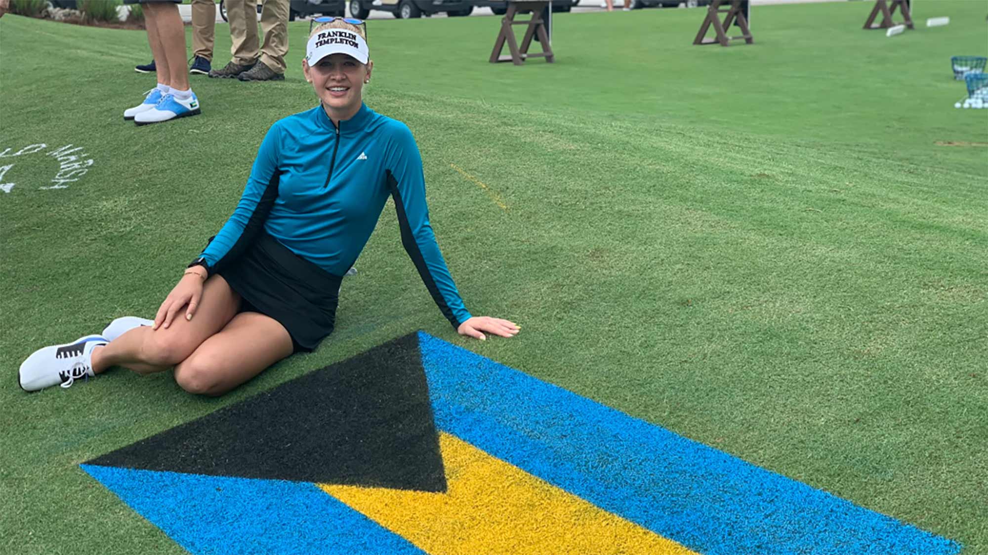 Jessica Korda poses with the flag of the Bahamas during the Bahamas Strong Pro-Am at Old Marsh Golf Club in Palm Beach Gardens on October 8, 2019