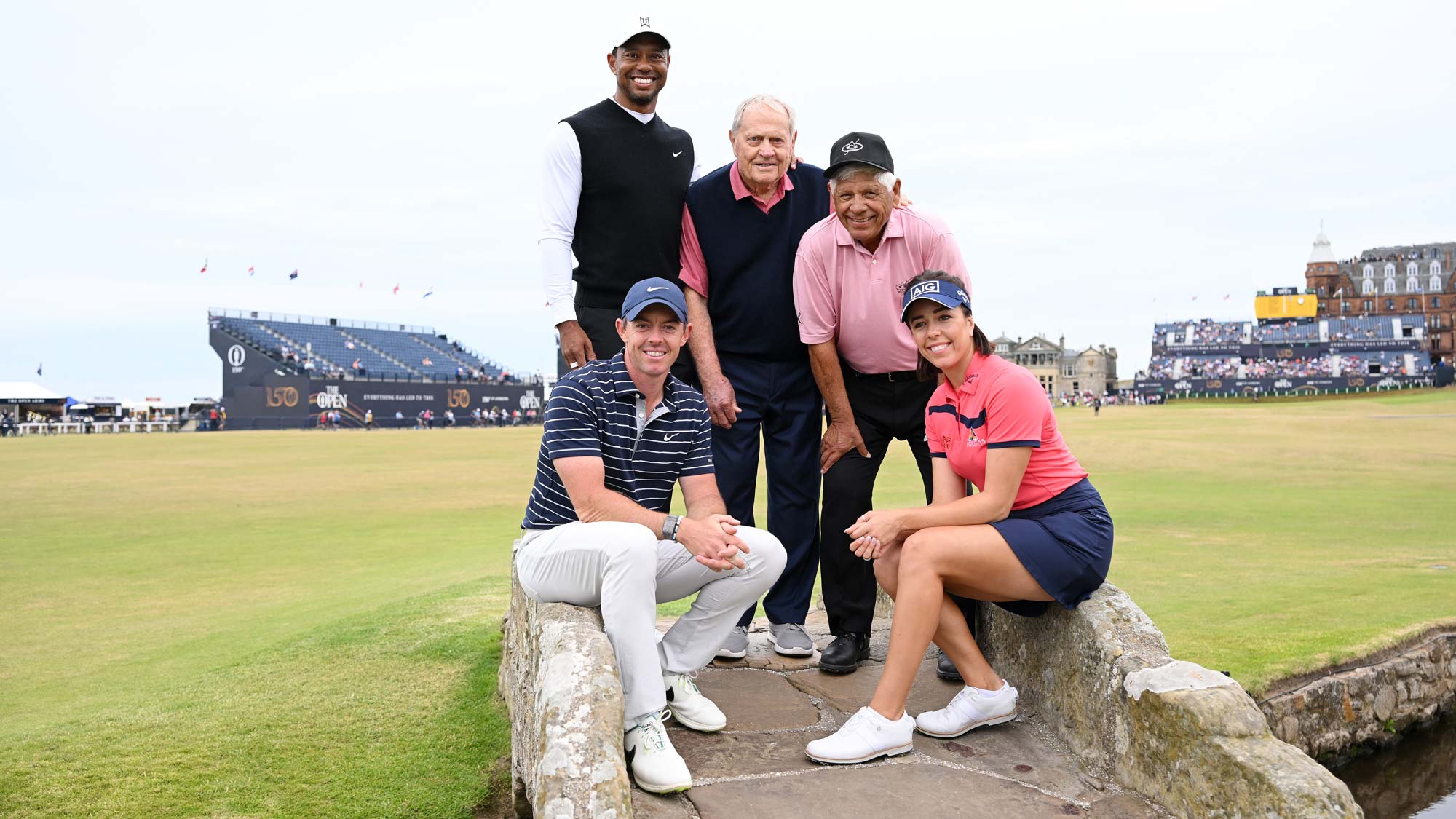 Rory McIlroy of Northern Ireland, Tiger Woods of The United States, Jack Nicklaus, Lee Trevino of The United States and Georgia Hall of England pose for a photo on the 18th bridge during the Celebration of Champions Challenge during a practice round prior to The 150th Open at St Andrews Old Course 