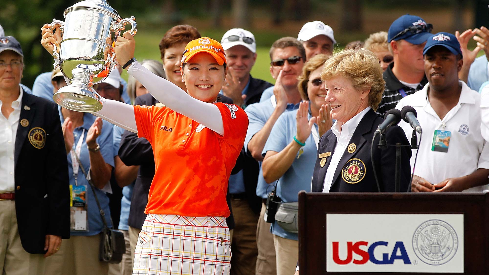 So Yeon Ryu of South Korea receives the trophy from Martha Lang, Chairman of the USGA Women's Committee, after winning in a playoff against Hee Kyung Seo of South Korea during the final round of the U.S. Women's Open