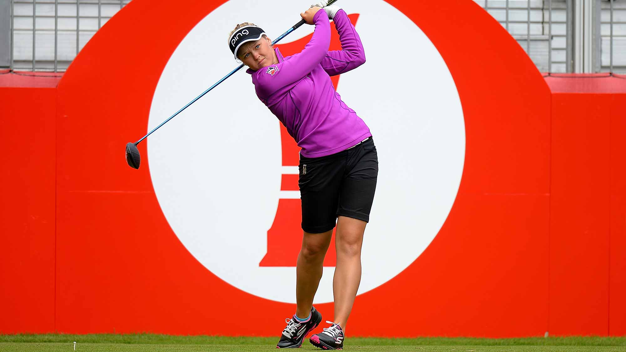 Brooke Henderson of Canada tees off during a Pro-Am round ahead of the Ricoh Women's British Open 