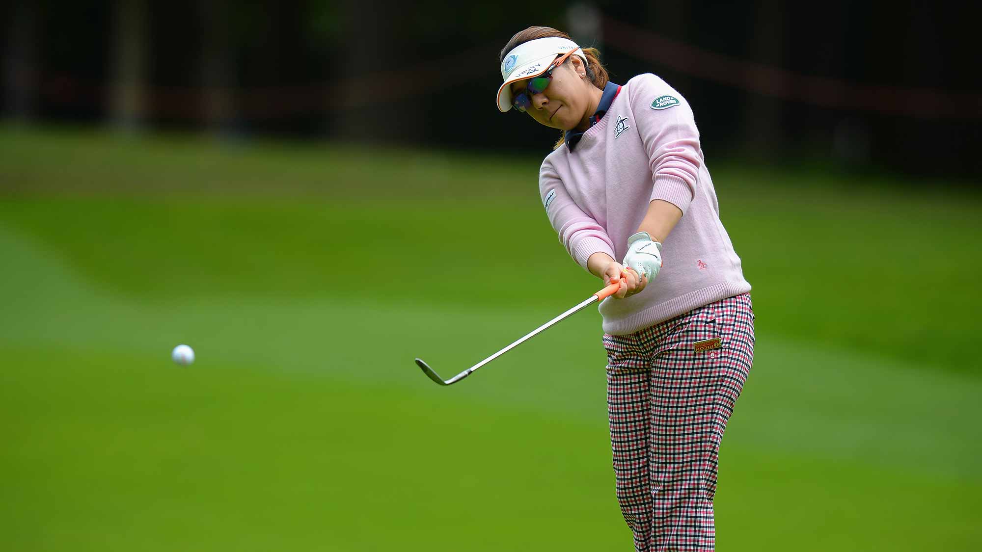Mika Miyazoto of Japan chips on to the 4th green during the Ricoh Women's British Open