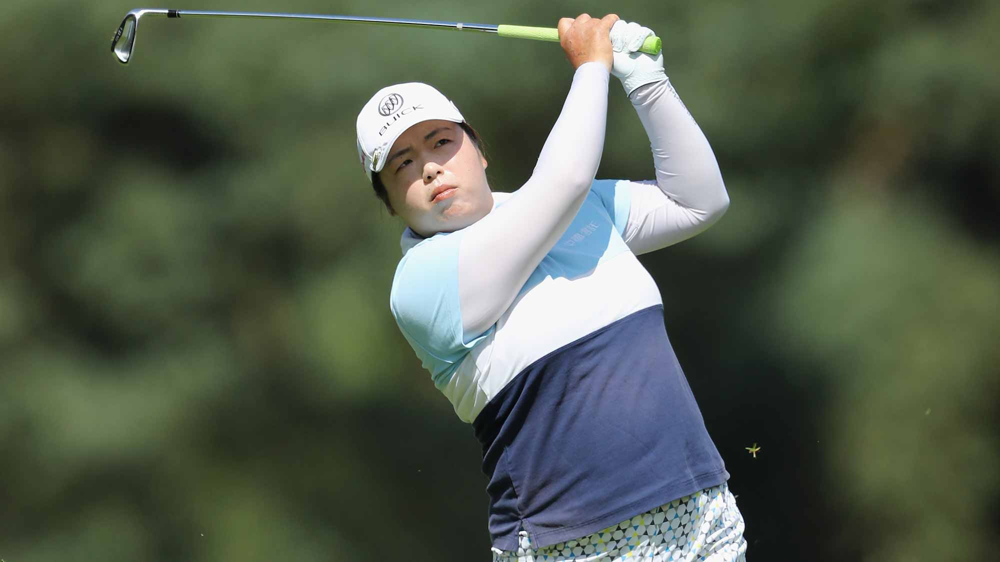 Shanshan Feng of China hits her second shot on the 1st hole during the first round of the 2016 Ricoh Women's British Open