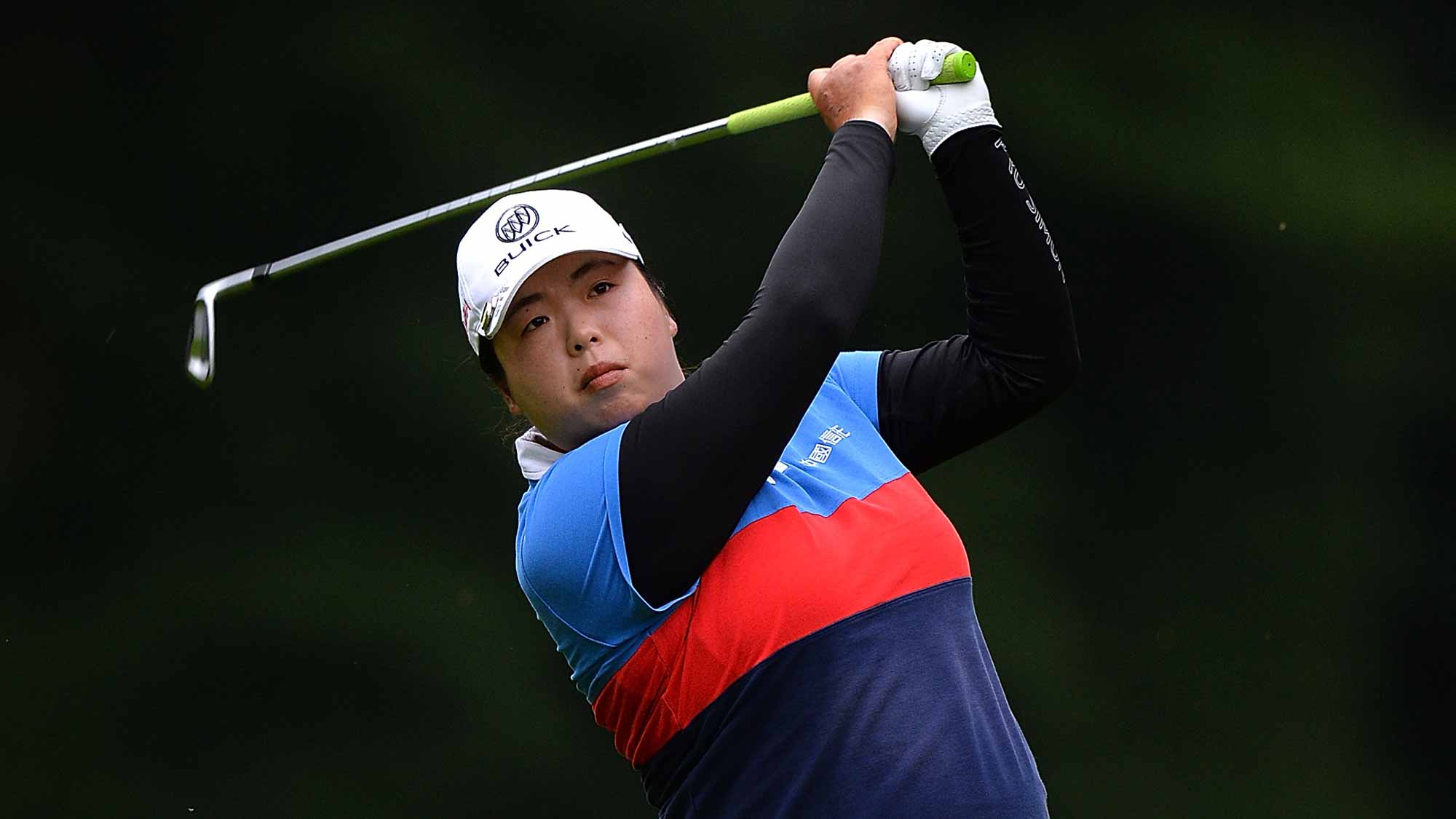 Shanshan Feng of China hits her second shot on the 3rd hole during the second round of the Ricoh Women's British Open at Woburn Golf Club