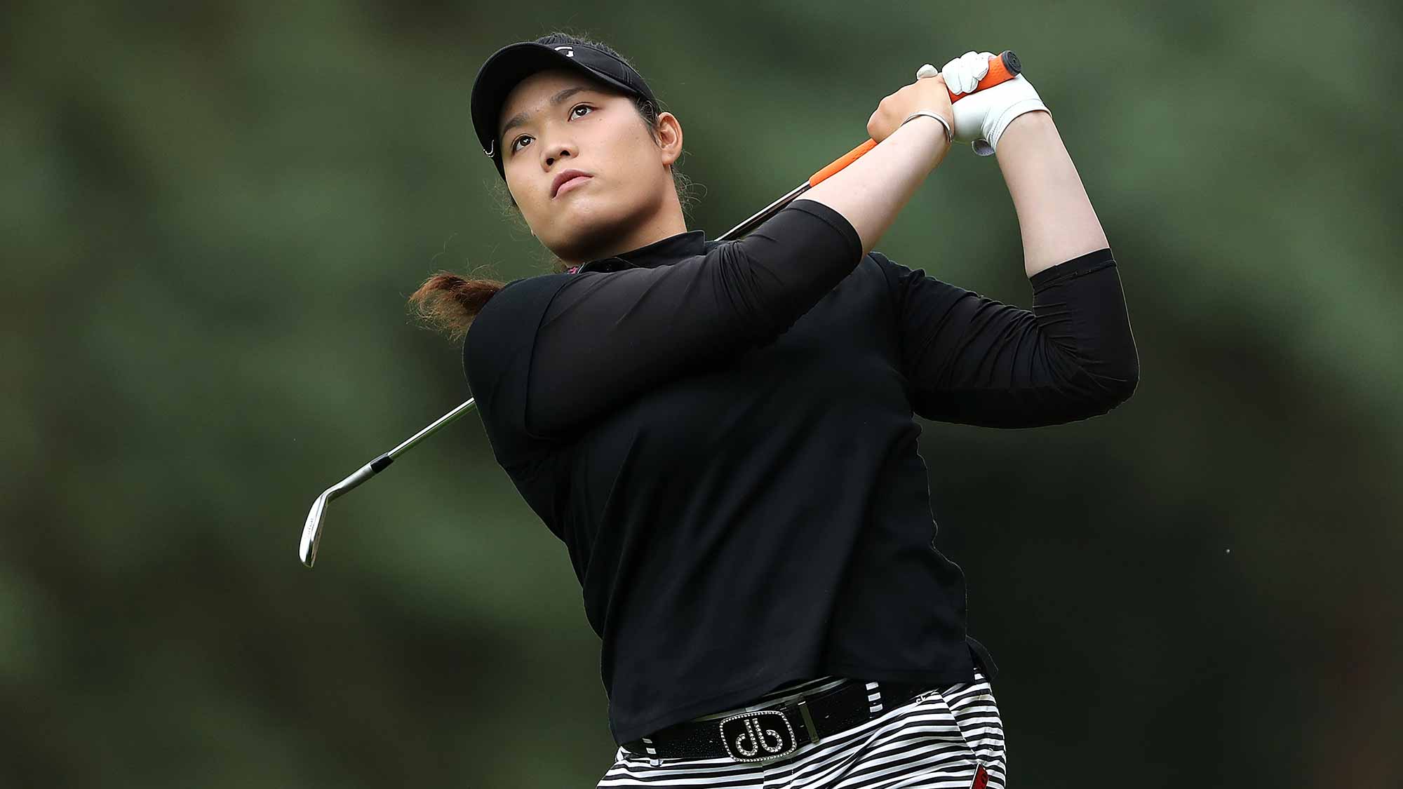 Ariya Jutanugarn of Thailand hits her second shot on the 1st hole during the final round of the Ricoh Women's British Open at Woburn Golf Club
