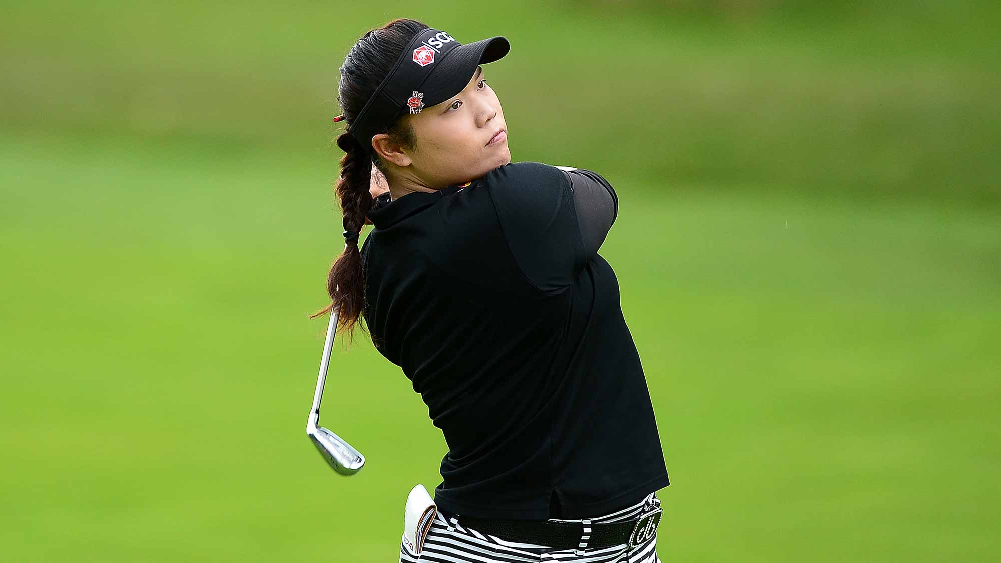 Ariya Jutanugarn of Thailand hits her second shot on the 2nd hole during the final round of the Ricoh Women's British Open at Woburn Golf Club