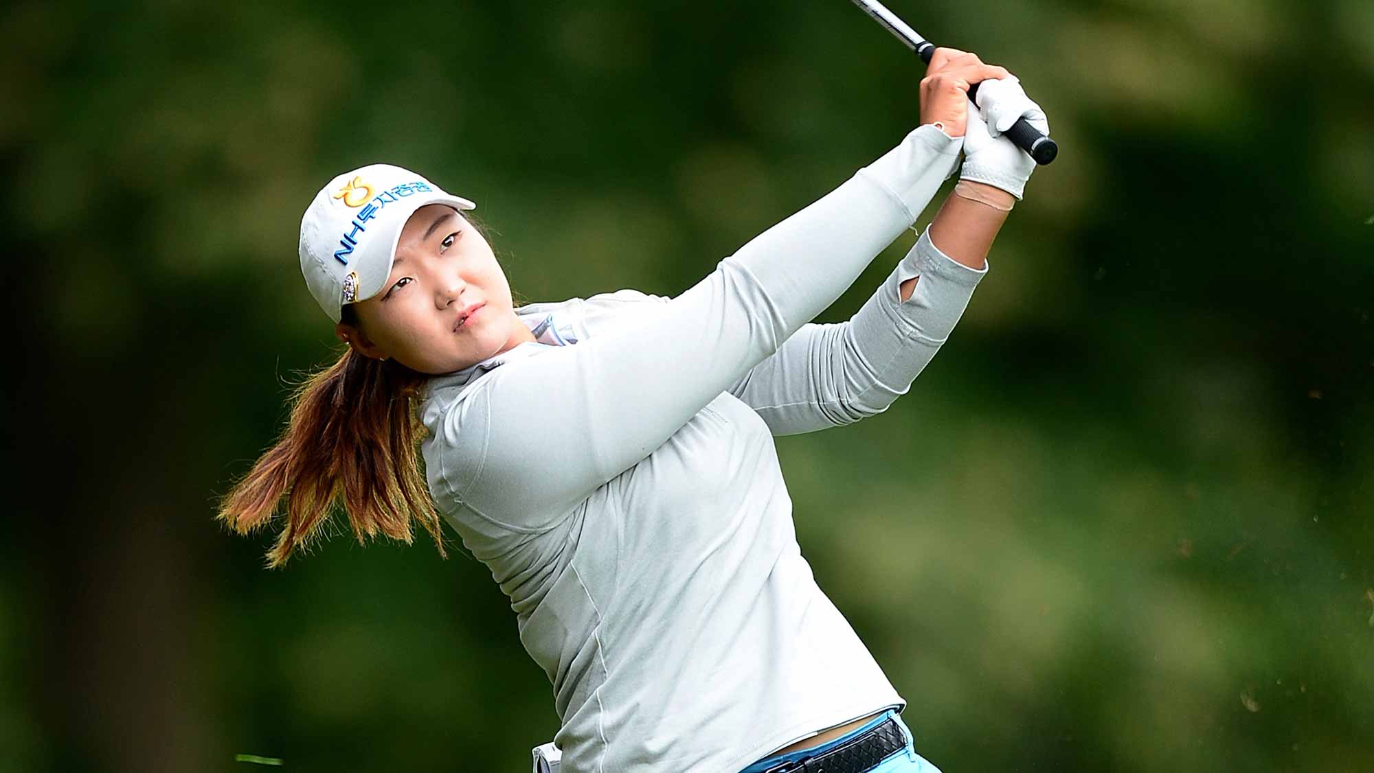 Mirim Lee of Korea hits her second shot on the 1st hole during the final round of the Ricoh Women's British Open at Woburn Golf Club