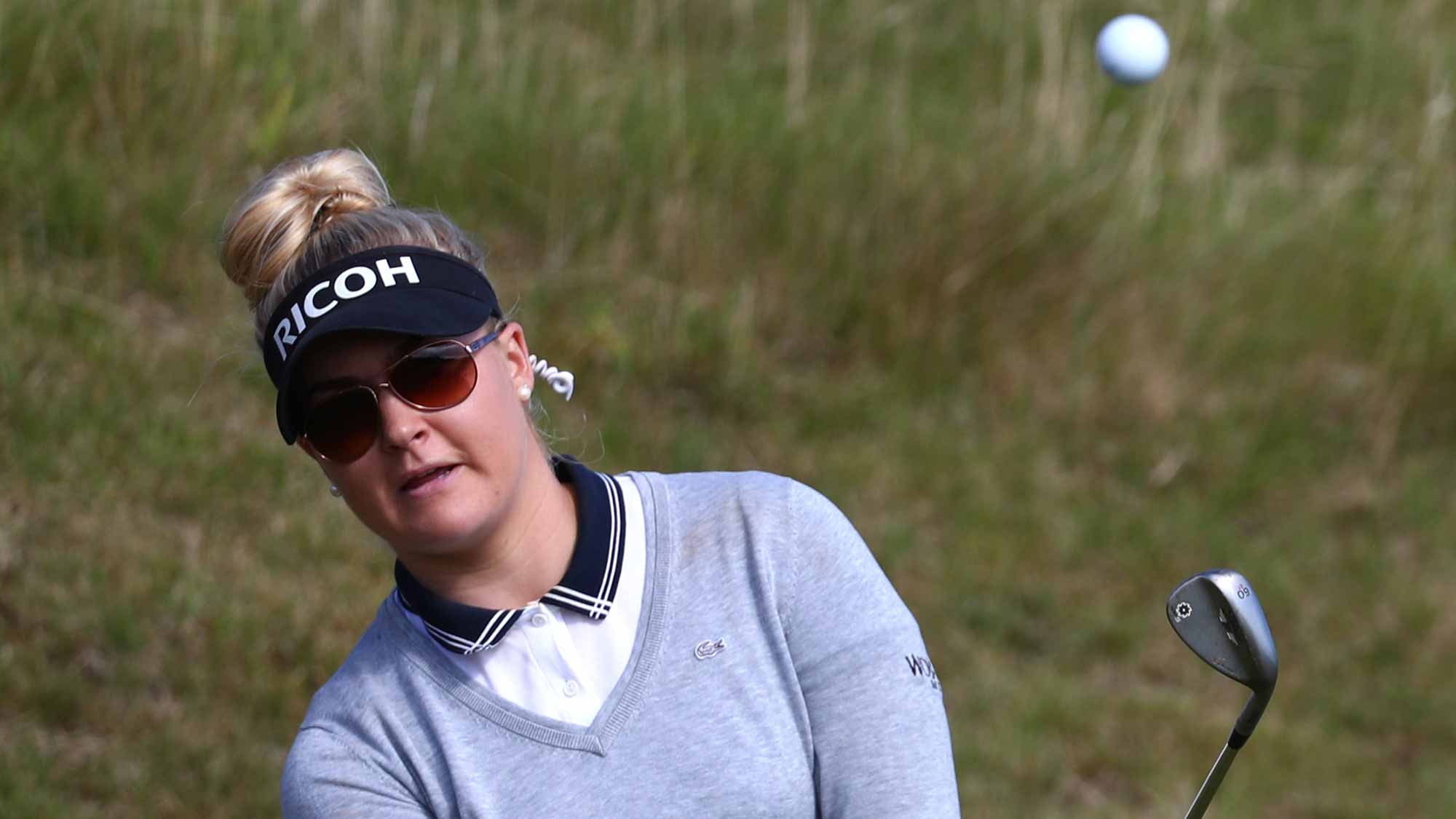 Charley Hull of England chips during a practice round prior to the Ricoh Women's British Open at Kingsbarns Golf Links