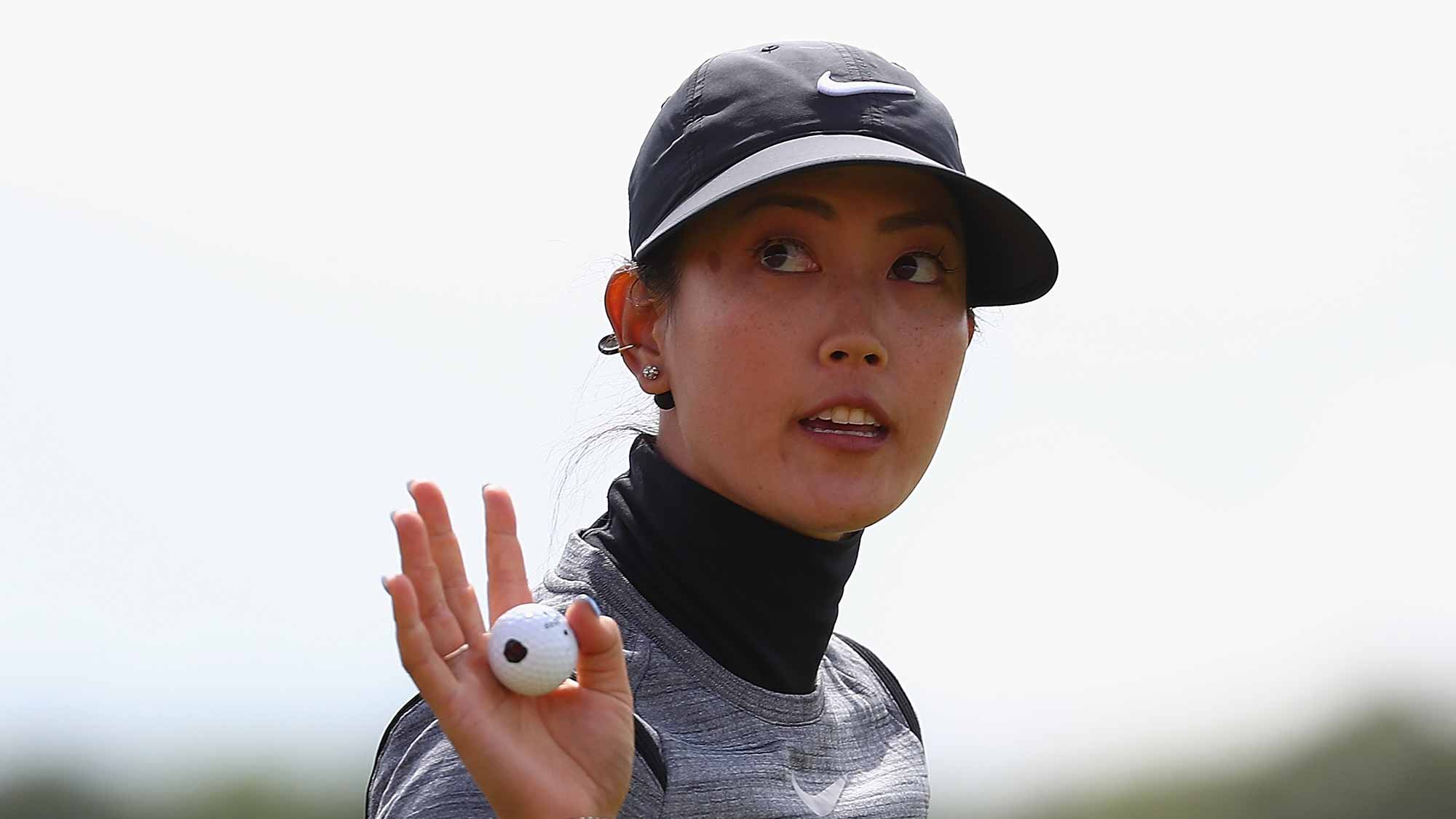 Michelle Wie of the United States celebrates her putt on the 18th green during the first round of the Ricoh Women's British Open at Kingsbarns Golf Links 