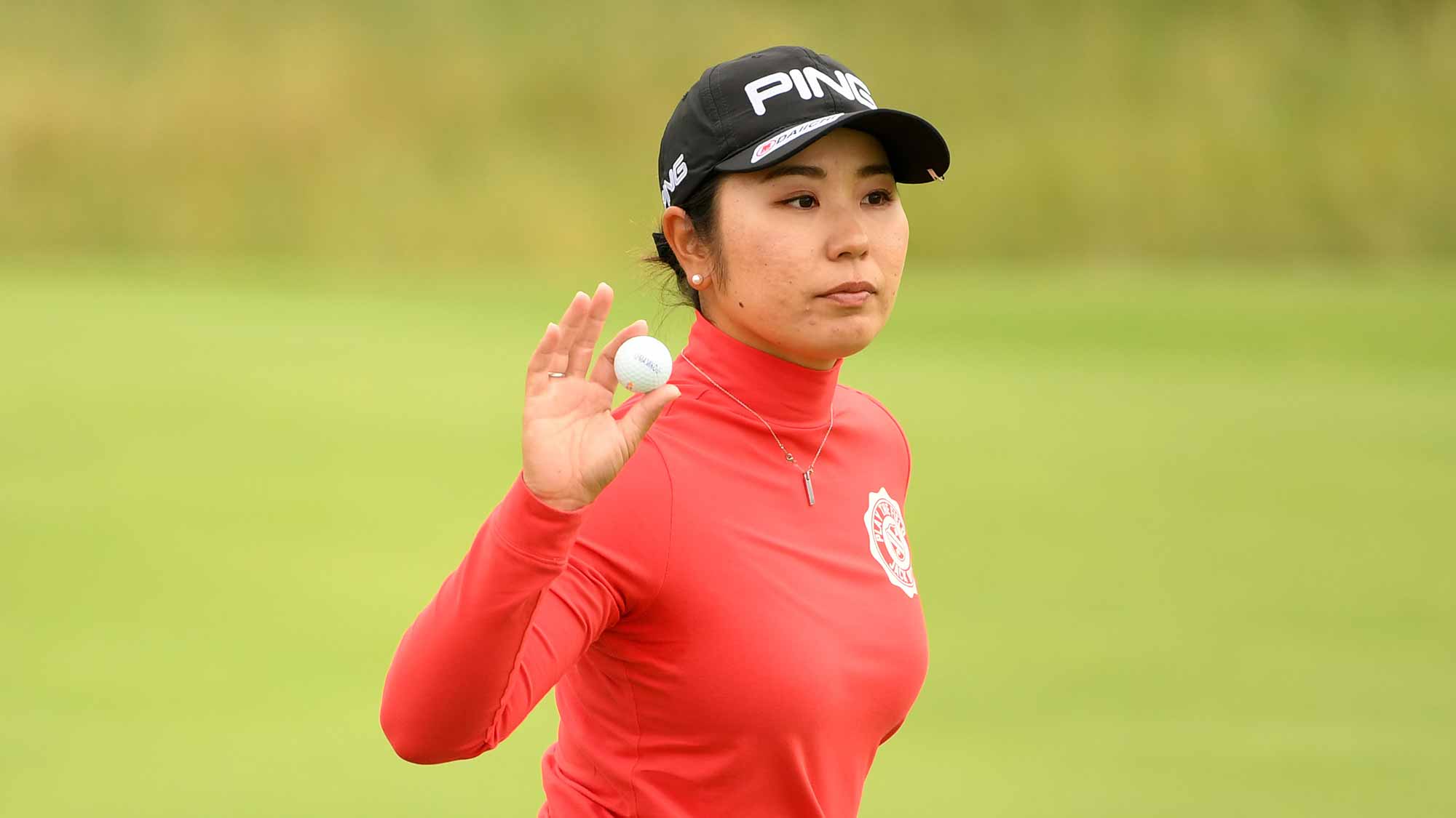 Mamiko Higa of Japan acknowledges the crowd after a shot on 3rd green during day three of Ricoh Women's British Open at Royal Lytham & St. Annes on August 4, 2018 in Lytham St Annes, England
