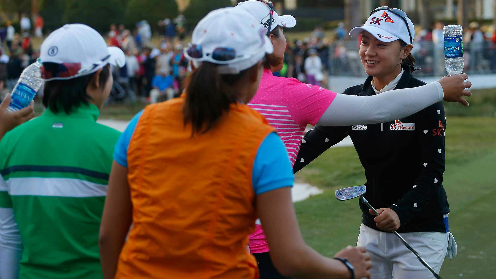 Na Yeon Choi of South Korea is congratulated by Amy Yang of South Korea and other players on the 18th green following her victory at the Coates Golf Championship