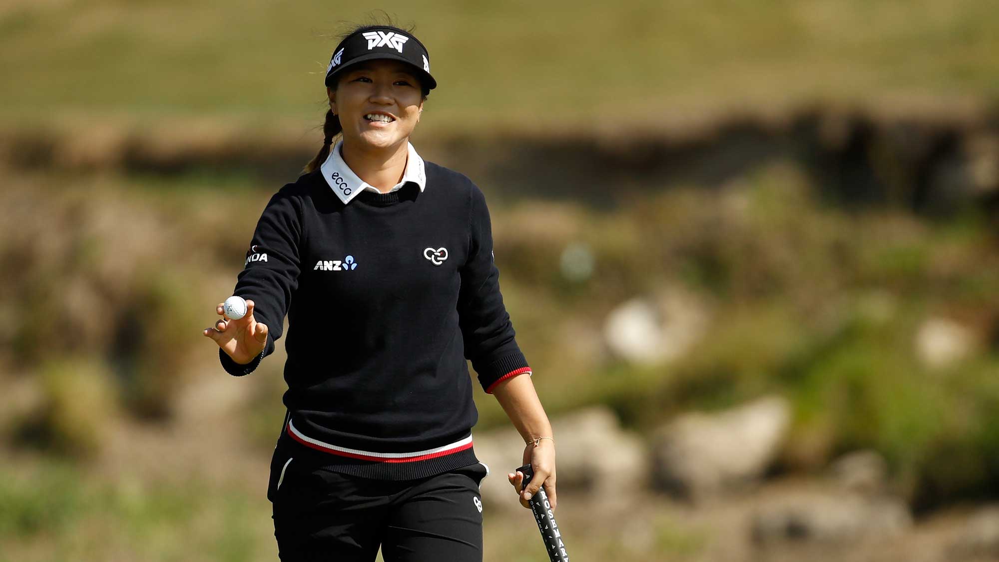 Lydia Ko of New Zealand waves to the crowd after making birdie on the 5th hole during the final round of the Indy Women In Tech Championship-Presented By Guggenheim