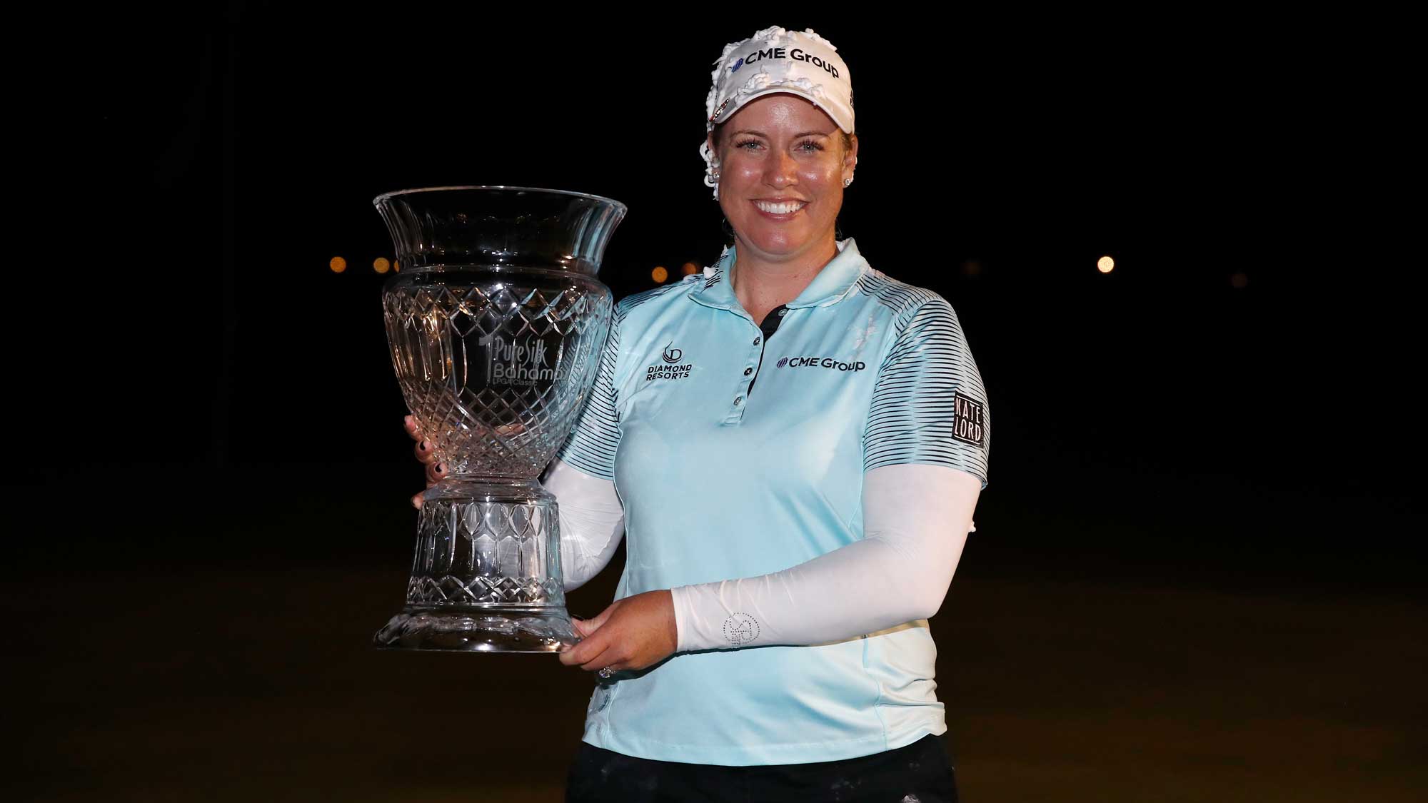 Brittany Lincicome holds the winner's trophy after winning the Pure Silk Bahamas LPGA Classic