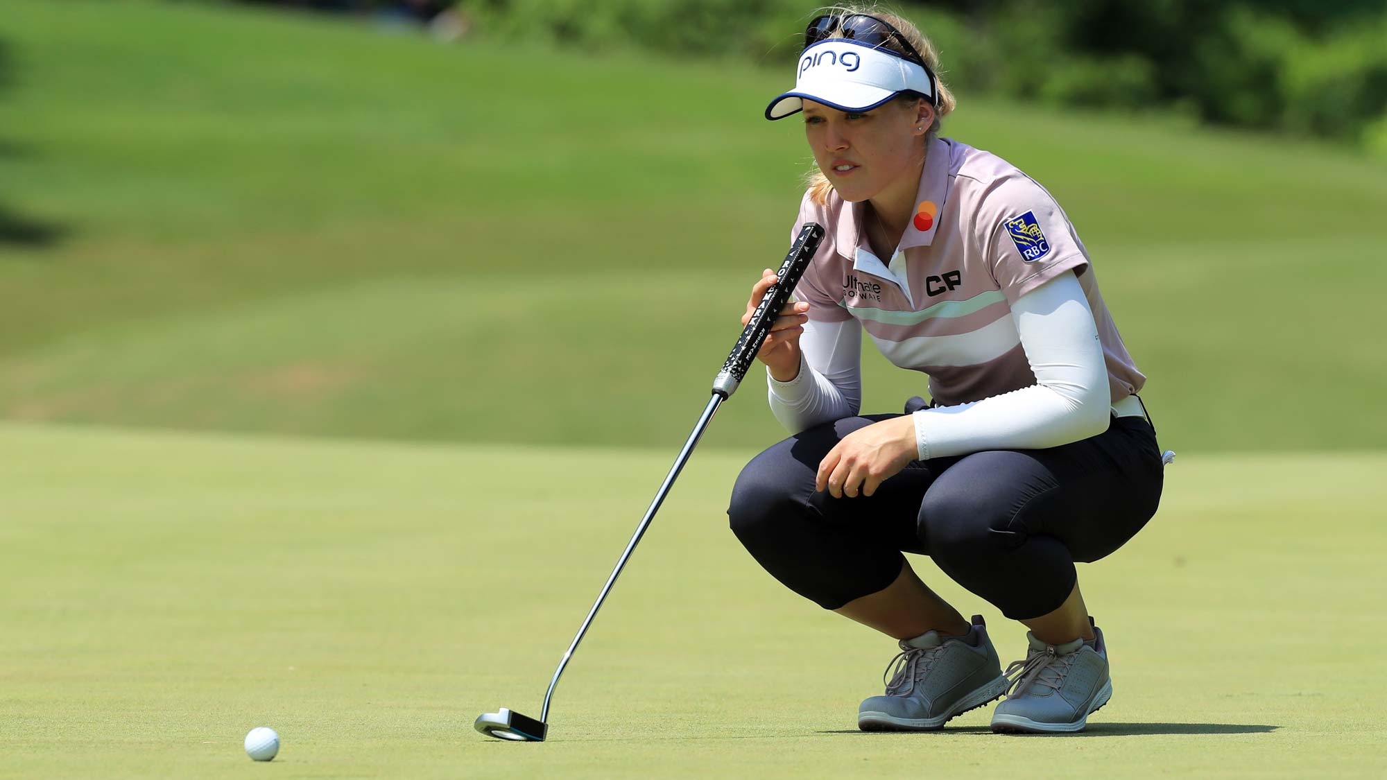 Brooke M. Henderson of Canada lines up her putt on the fourth hole during the first round of the Pure Silk Championship