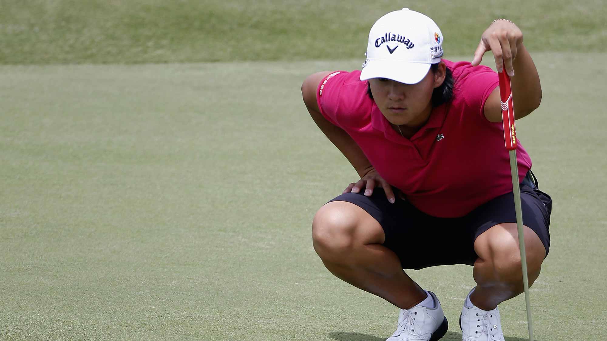 Yani Tseng of Taiwan lines up a putt on the 5th hole during the final round of the Yokohama Tire LPGA Classic at the Robert Trent Jones Golf Trail at Capitol Hill 