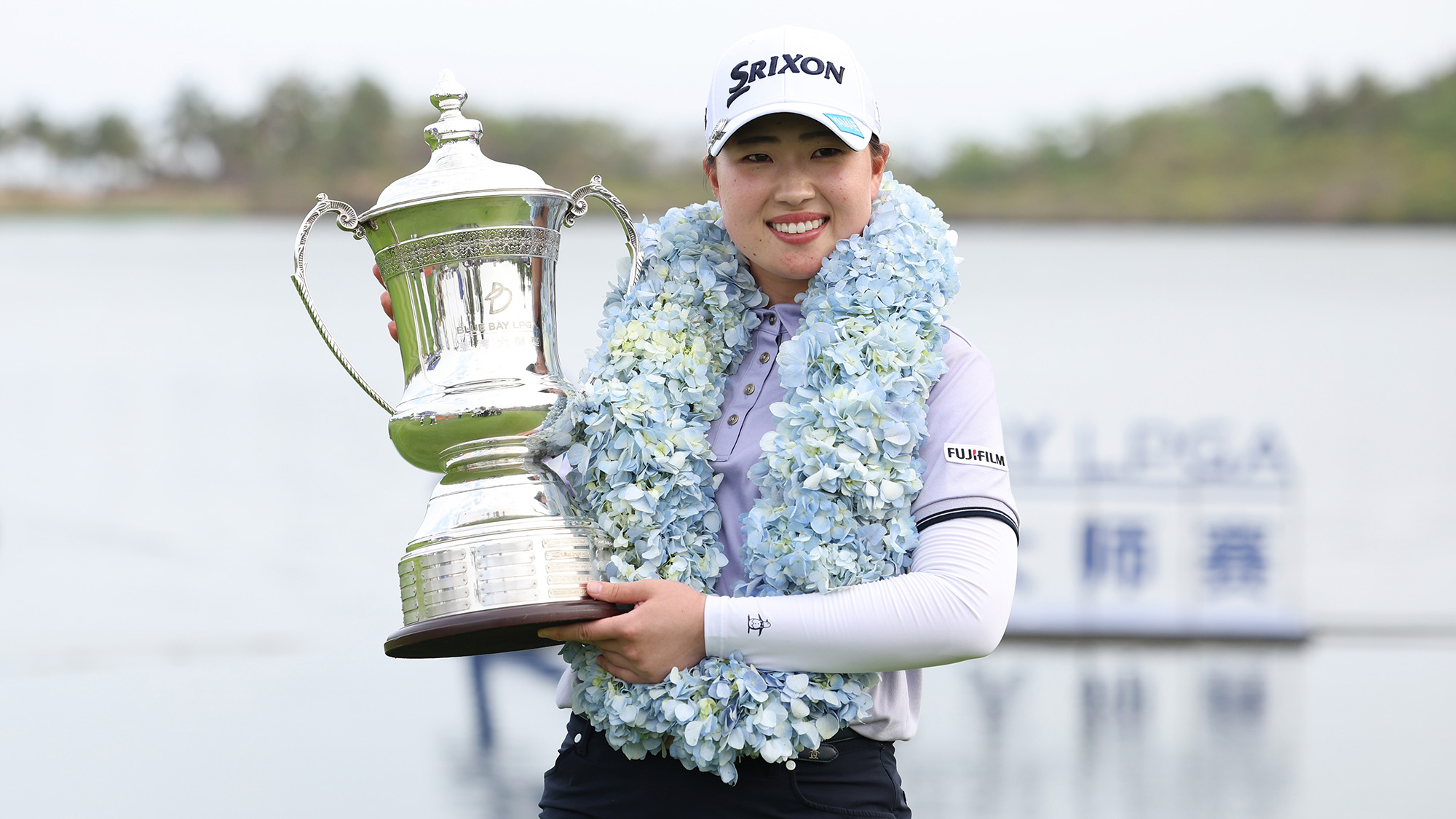 Rio Takeda of Japan poses with the trophy after winning the final round of the Blue Bay LPGA 2025 at Jian Lake Blue Bay Golf Course on March 09, 2025 in Hainan Island, China.