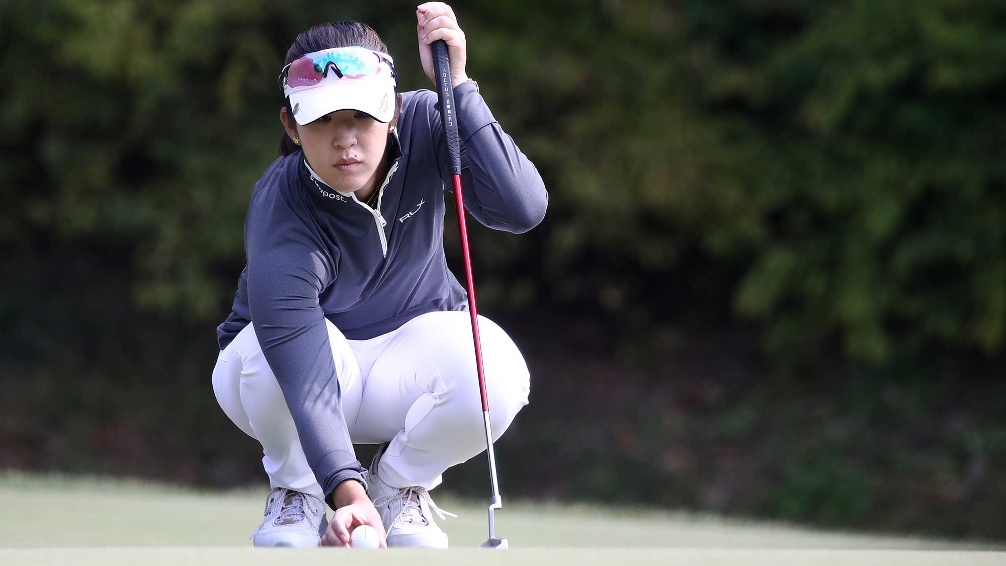 Andrea Lee of the United States lines up a putt on the second green during the second round of the BMW Ladies Championship