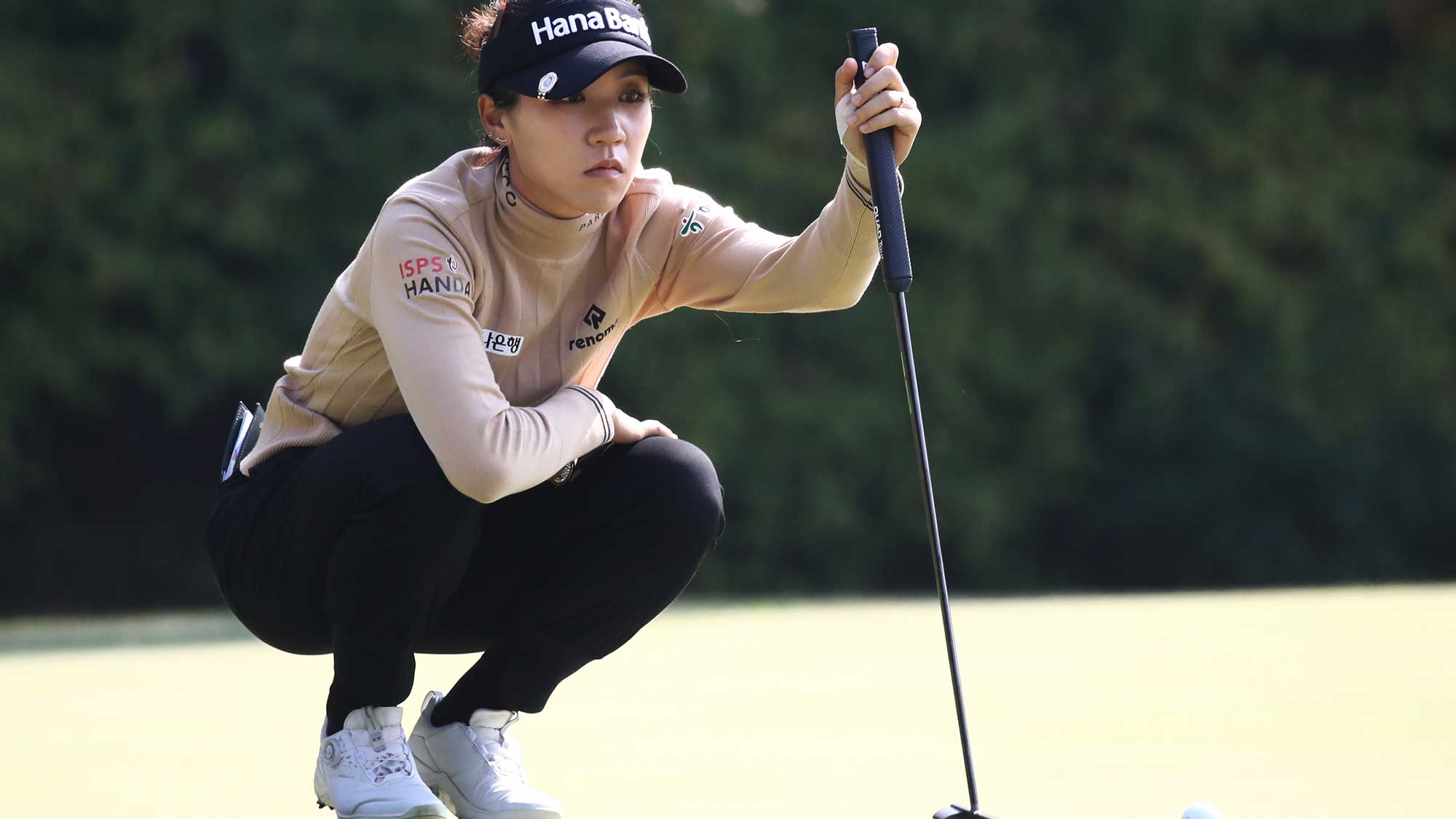 Lydia Ko of New Zealand lines up a putt on the seventh green during the third round of the BMW Ladies Championship