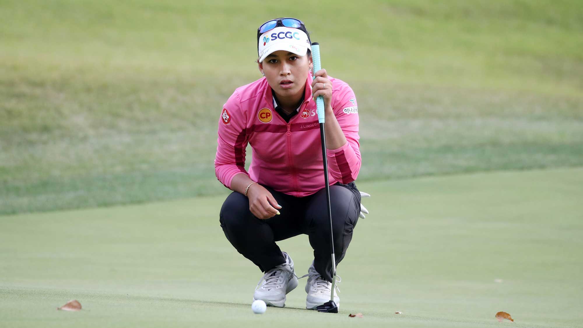 Atthaya Thitikul of Thailand lines up a putt on the 5th green during the final round of the BMW Ladies Championship