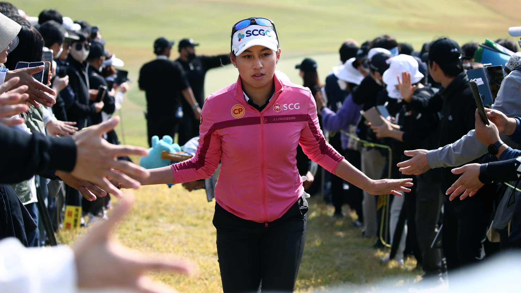 Atthaya Thitikul of Thailand interacts with fans during the final round of the BMW Ladies Championship