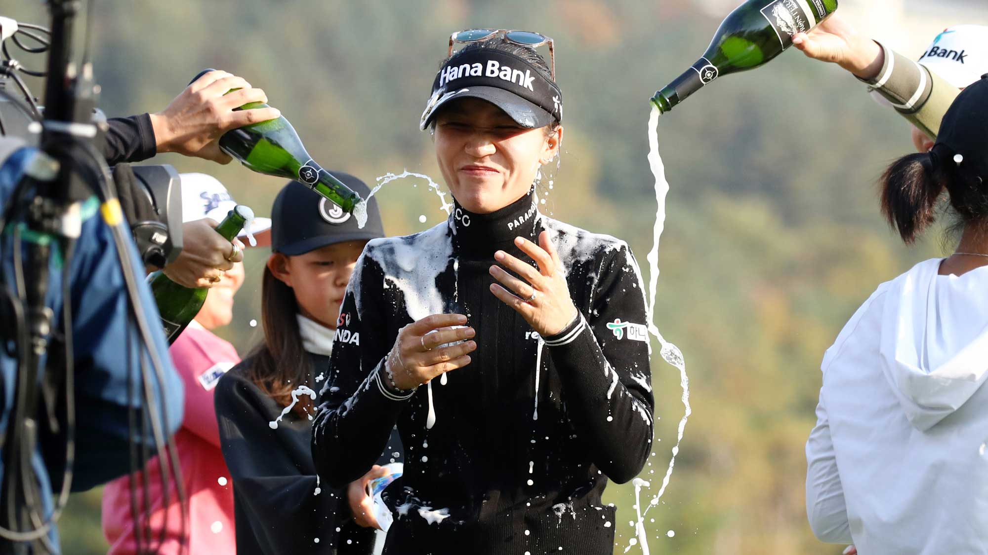 Lydia Ko of New Zealand is poured champagne after winning the tournament on the 18th green during the final round of the BMW Ladies Championship