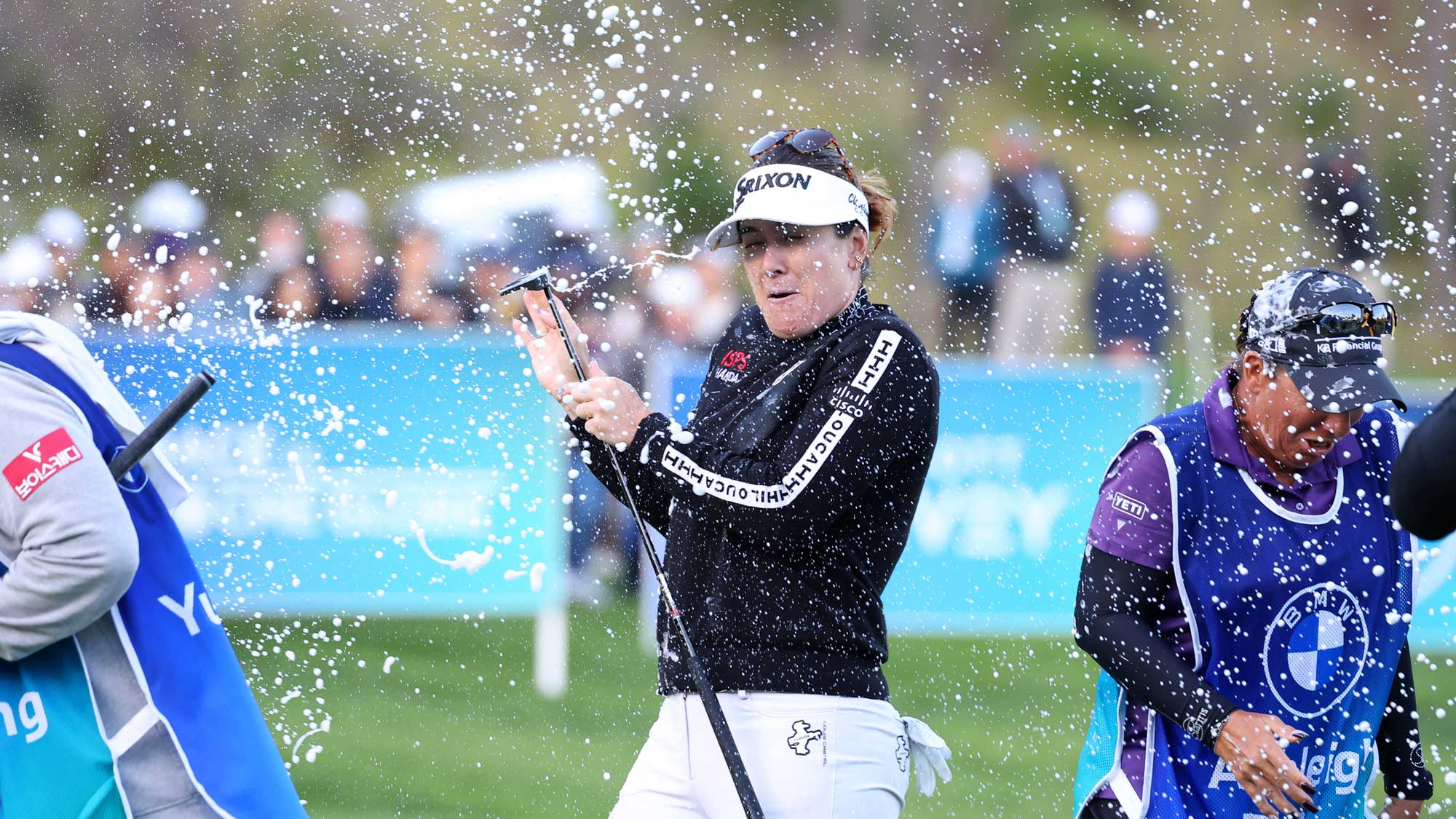 Hannah Green of Australia is poured champagne after winning the tournament on the 18th green during the final round of the BMW Ladies Championship 2024 at Seowon Hills Country Club on October 20, 2024 in Paju, South Korea.