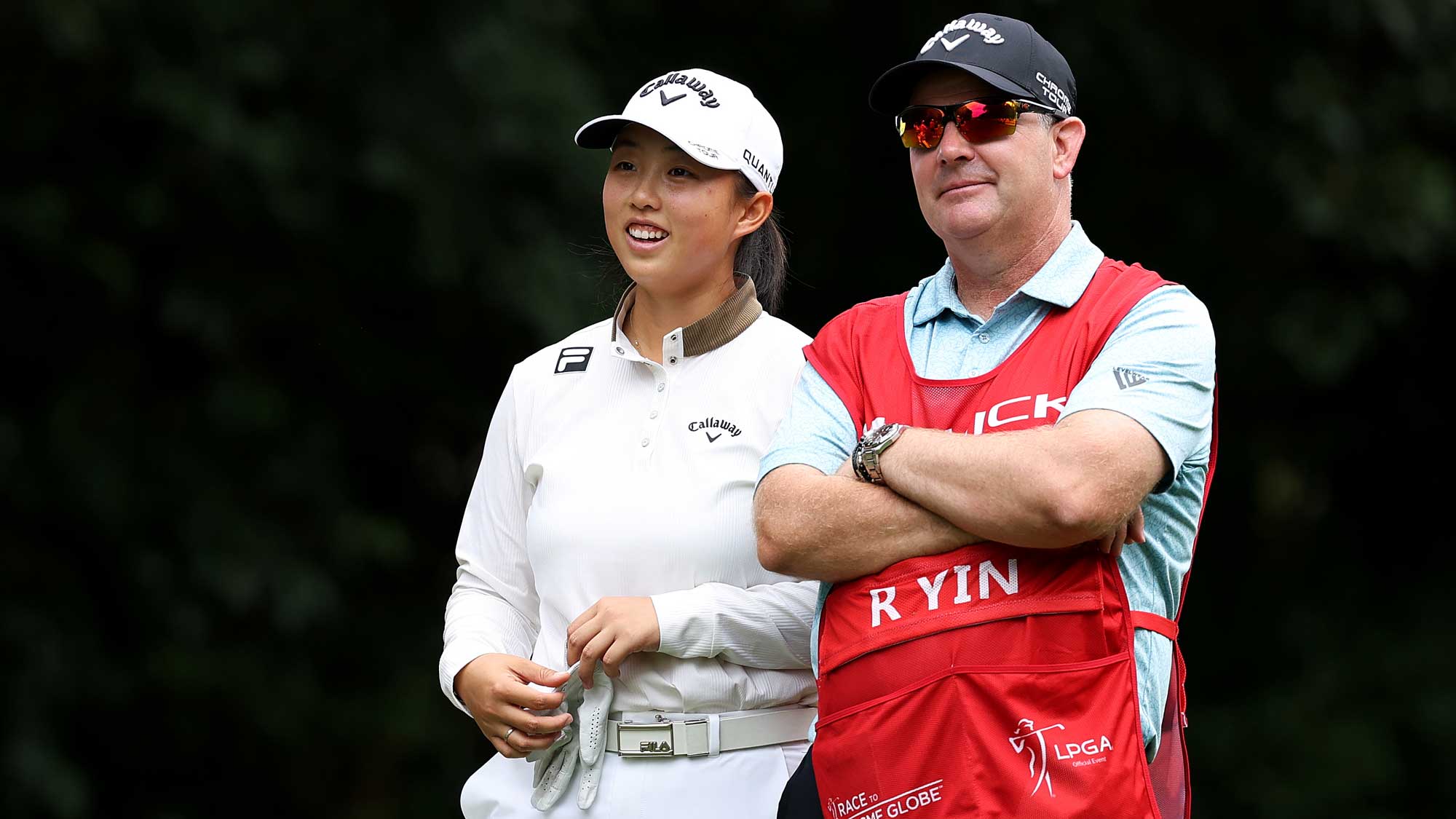 Ruoning Yin of China reacts with her caddie as she prepares to play a shot from the fifth tee during the first round of the Buick LPGA Shanghai 2026 at Sheshan Golf Club on October 15, 2026 in Shanghai, China. (