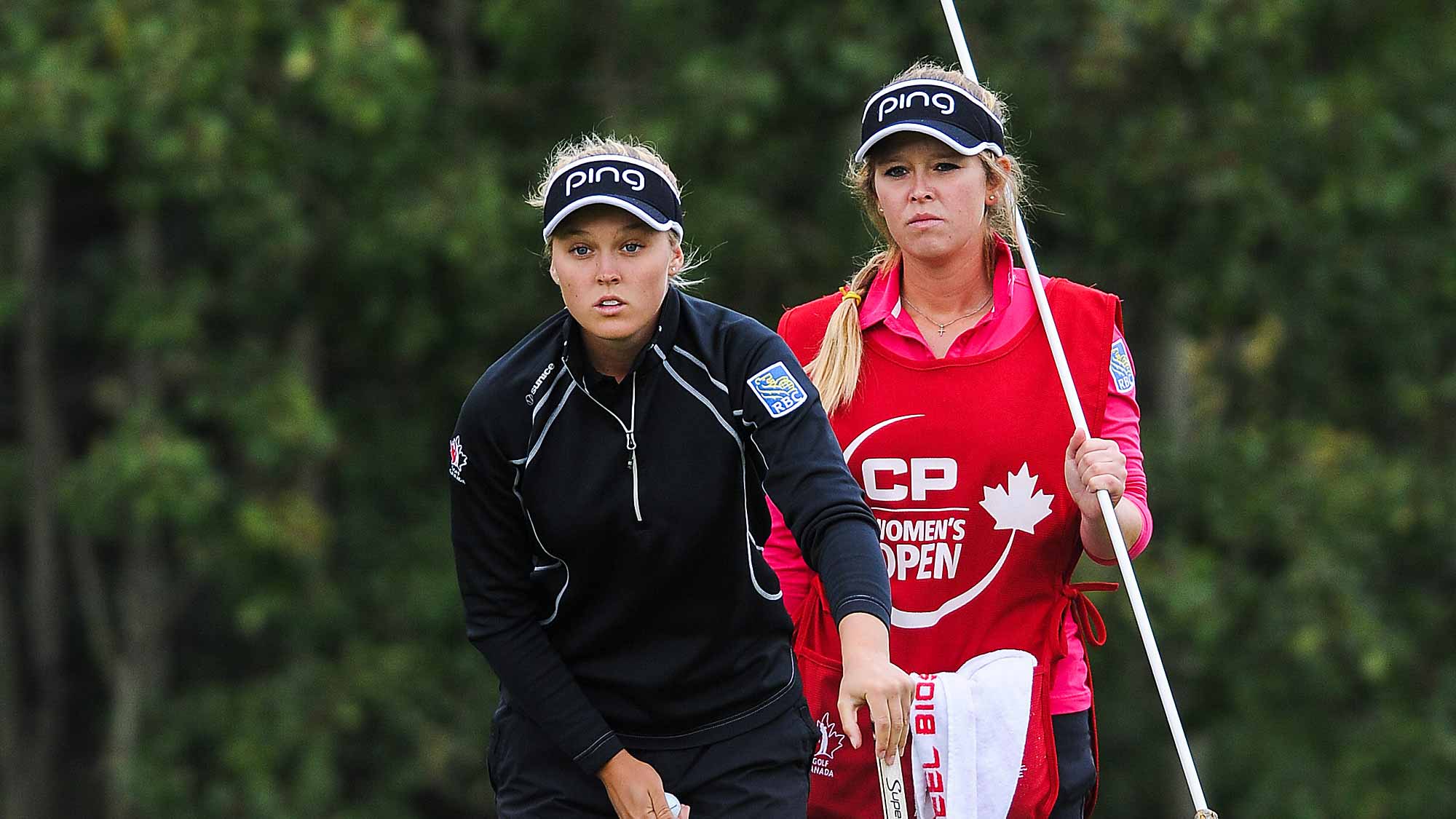 Brooke Henderson of Canada lines up a shot on the 4th hole during the first round of the Canadian Pacific Women's Open at Priddis Greens Golf and Country Club