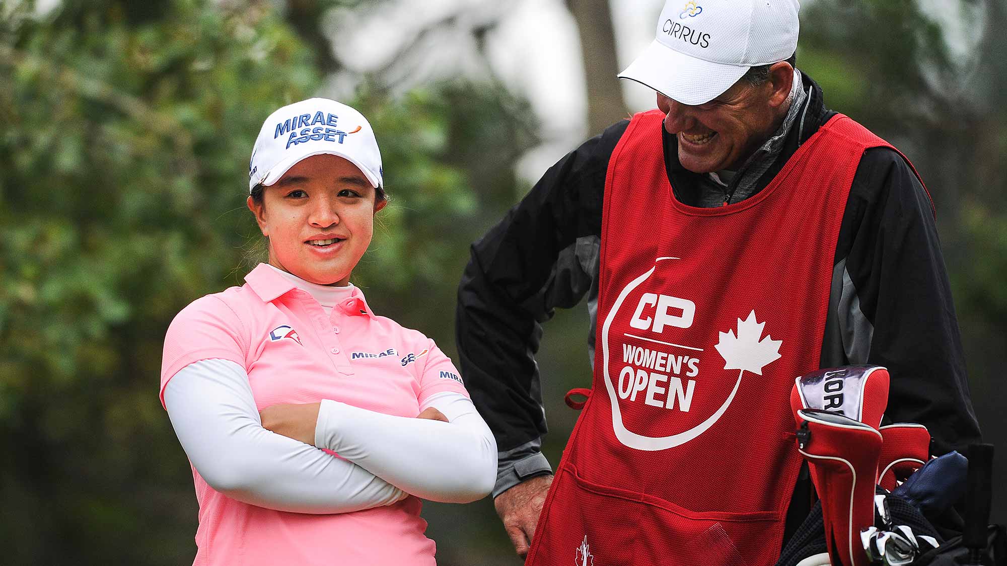Sei Young Kim of South Korea laughs with her caddy prior to her tee shot on the 11th hole during the first round of the Canadian Pacific Women's Open at Priddis Greens Golf and Country Club