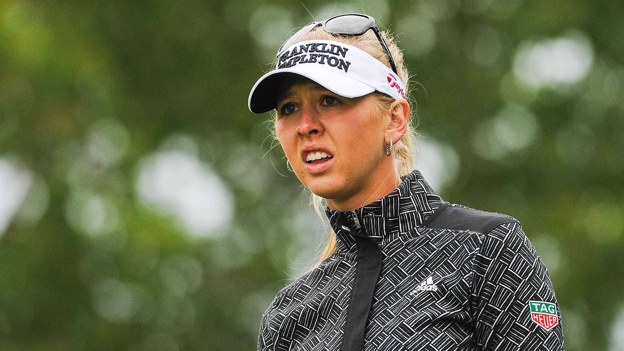 Jessica Korda reacts after taking her tee shot on the 11th hole during the first round of the Canadian Pacific Women's Open at Priddis Greens Golf and Country Club 