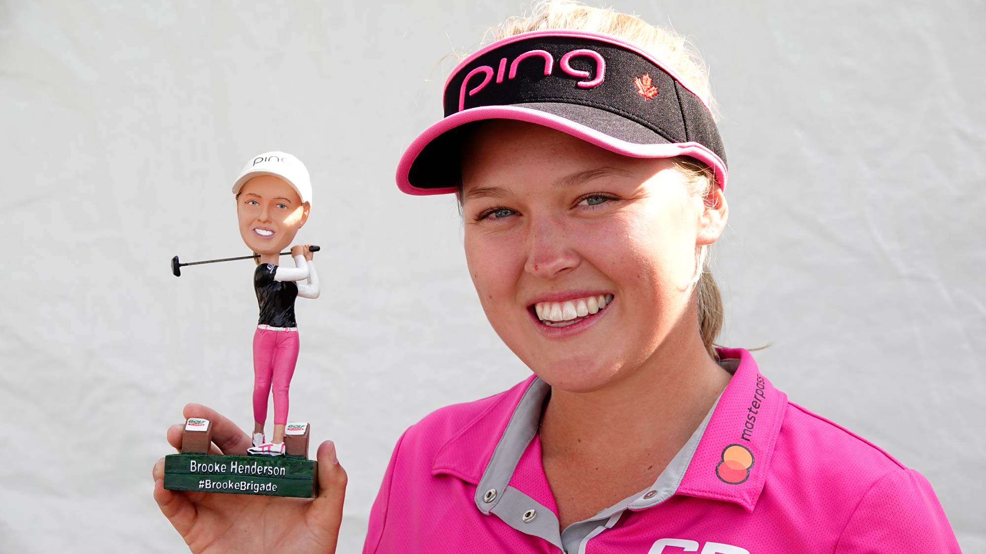 Brooke Henderson poses with her bobble head before the 2018 CP Women's Open