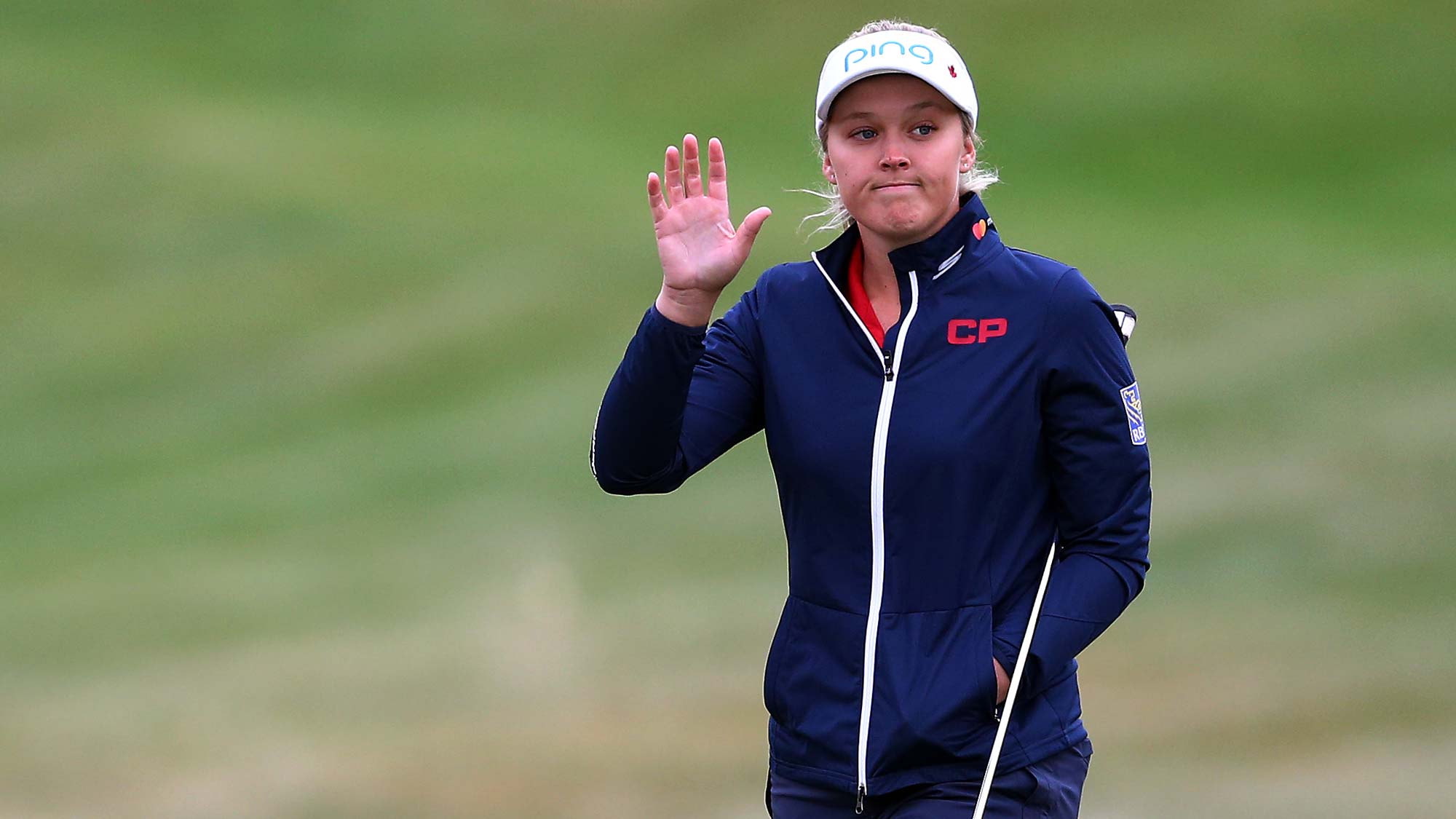 Brooke Henderson of Canada waves to the crowd on the 1st green during the final round of the CP Womens Open