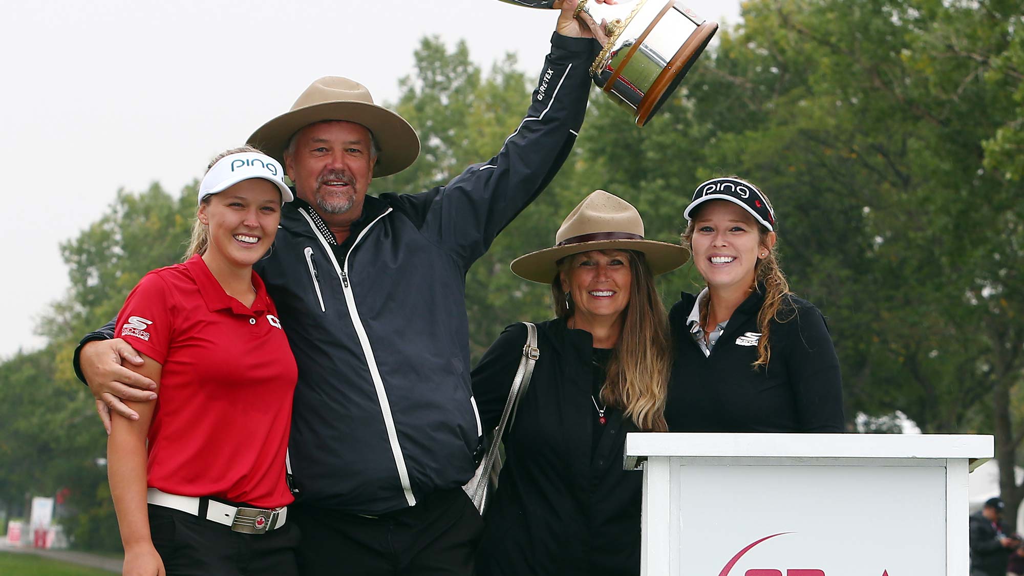 Brooke Henderson of Canada with the champions trophy and her dad, Dave, mother, Darlene and sister & caddie, Brittany, following the final round of the CP Womens Open