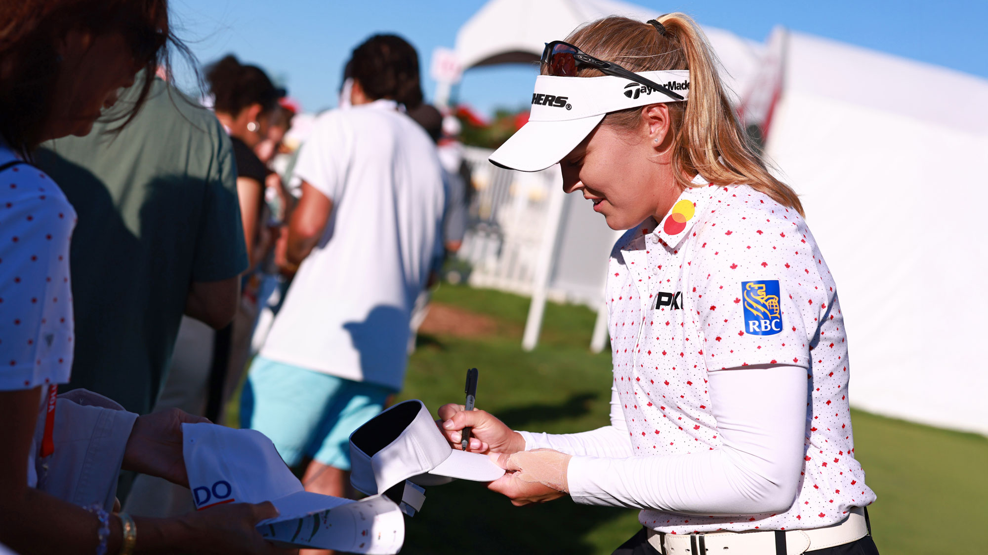 Brooke M. Henderson of Canada signs autographs following the first round of the CPKC Women's Open 2025 at Mississaugua Golf and Country Club on August 21, 2025 in Mississauga, Ontario.
