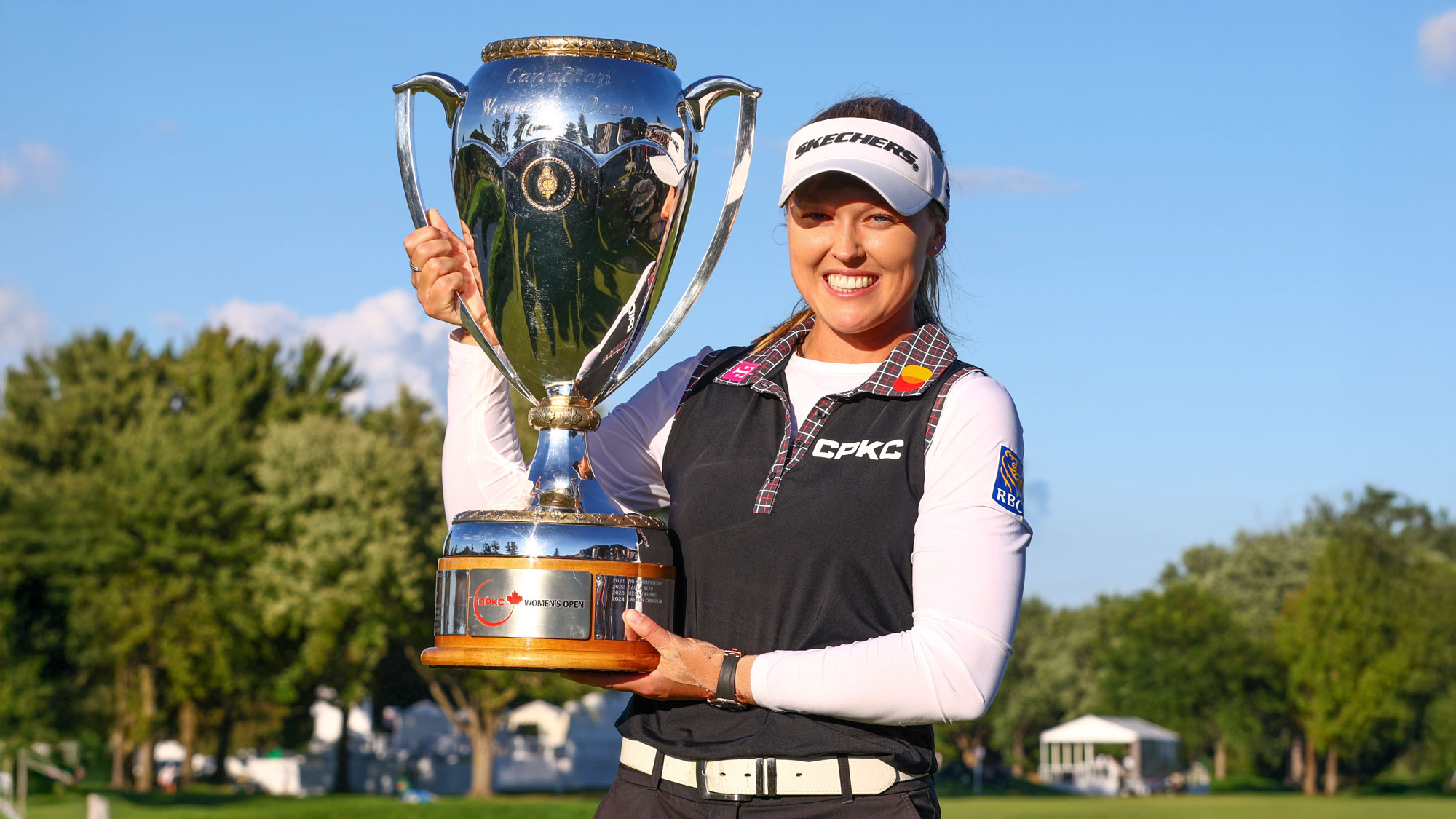 Brooke M. Henderson of Canada poses with the trophy after winning the CPKC Women's Open 2025 at Mississaugua Golf and Country Club on August 24, 2025 in Mississauga, Ontario.