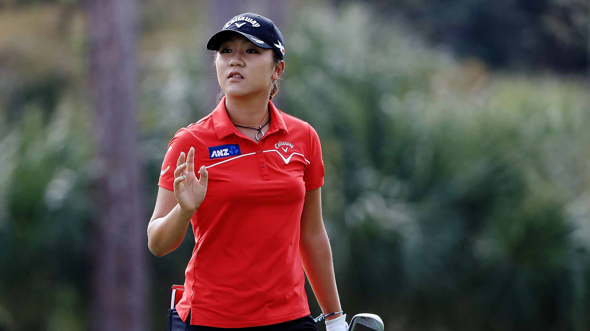 Lydia Ko of New Zealand waves to the crowd on the second hole during the second round of the CME Group Tour Championship at Tiburon Golf Club