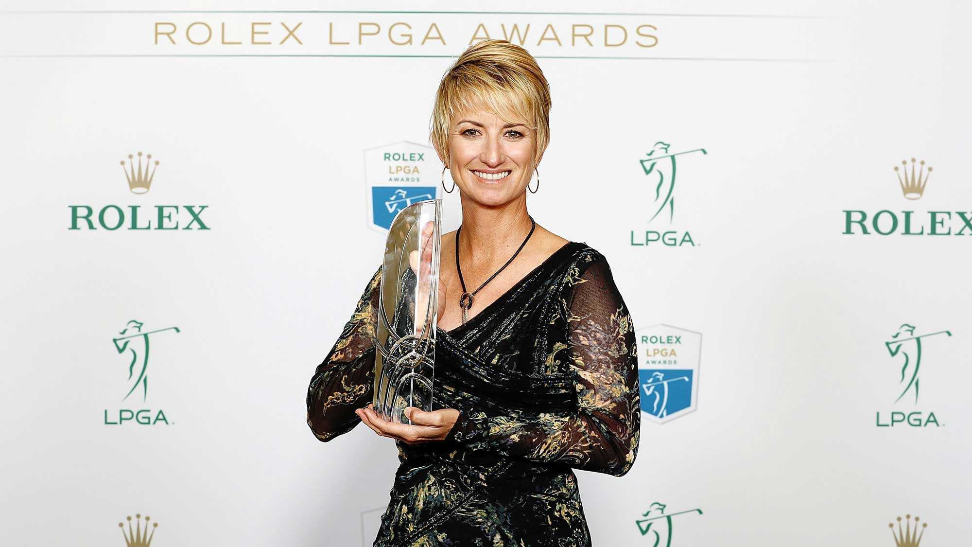 LPGA player Karrie Webb of Australia poses with the William & Mousie Powell Award at the Rolex LPGA Awards
