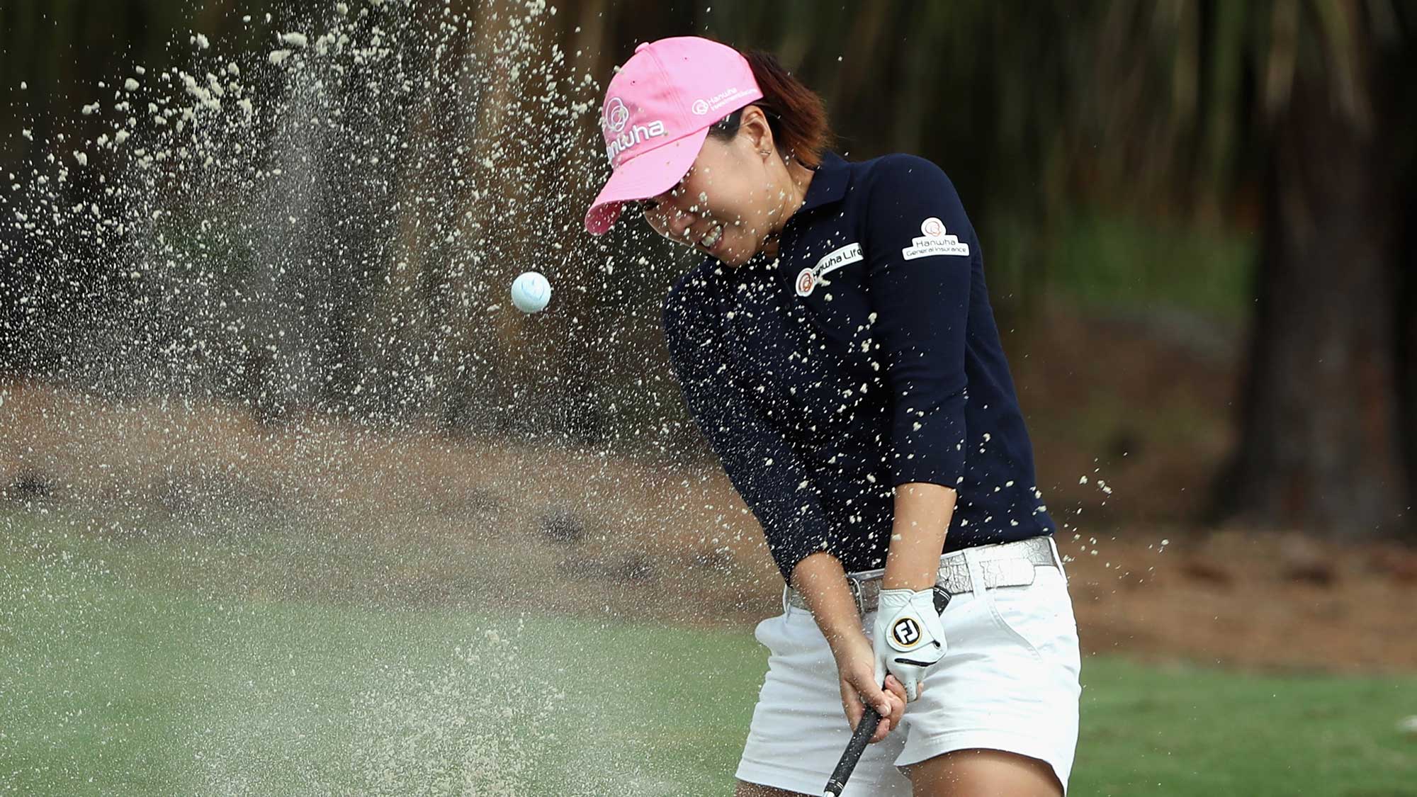In-Kyung Kim of Korea plays a shot from a greenside bunker on the sixth hole during round one of the CME Group Tour Championship
