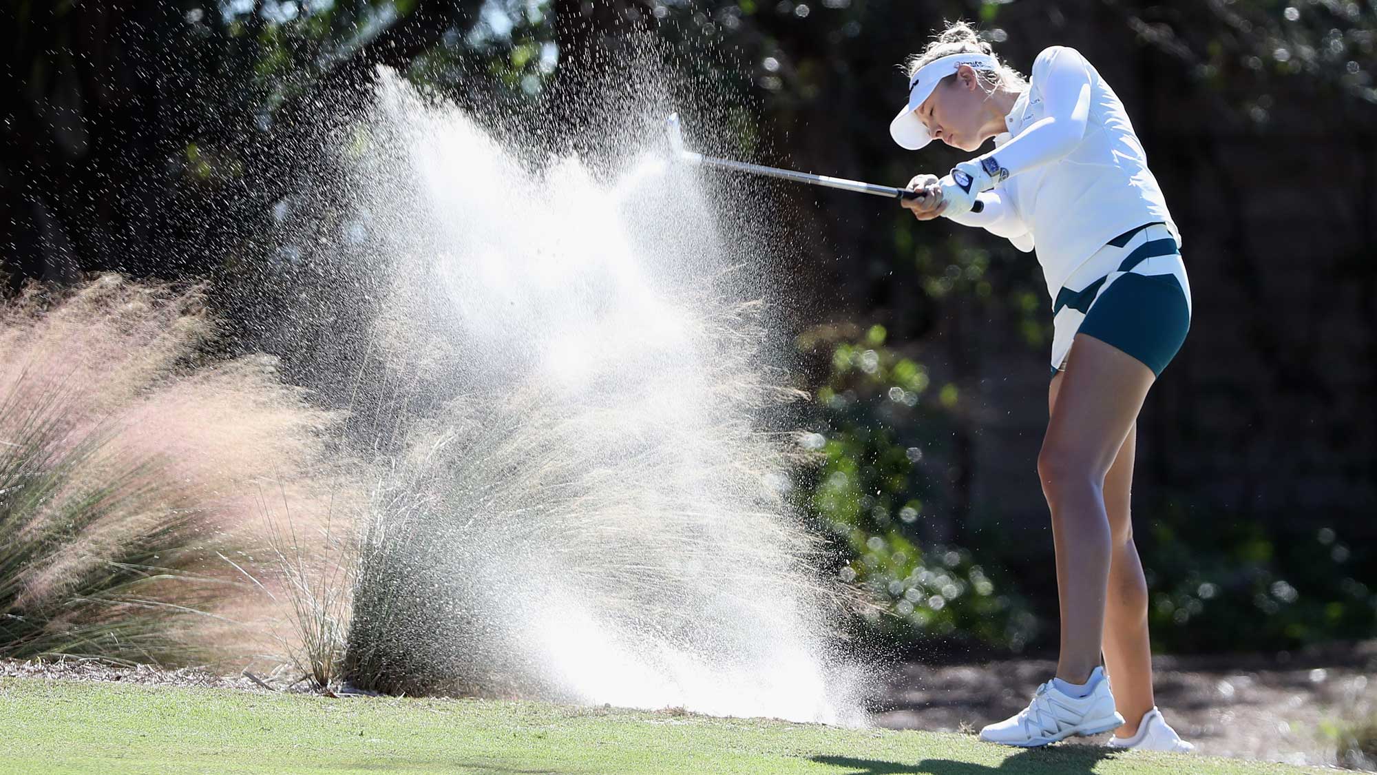 Nelly Korda of the United States plays a shot from a bunker on the second hole during round three of the CME Group Tour Championship