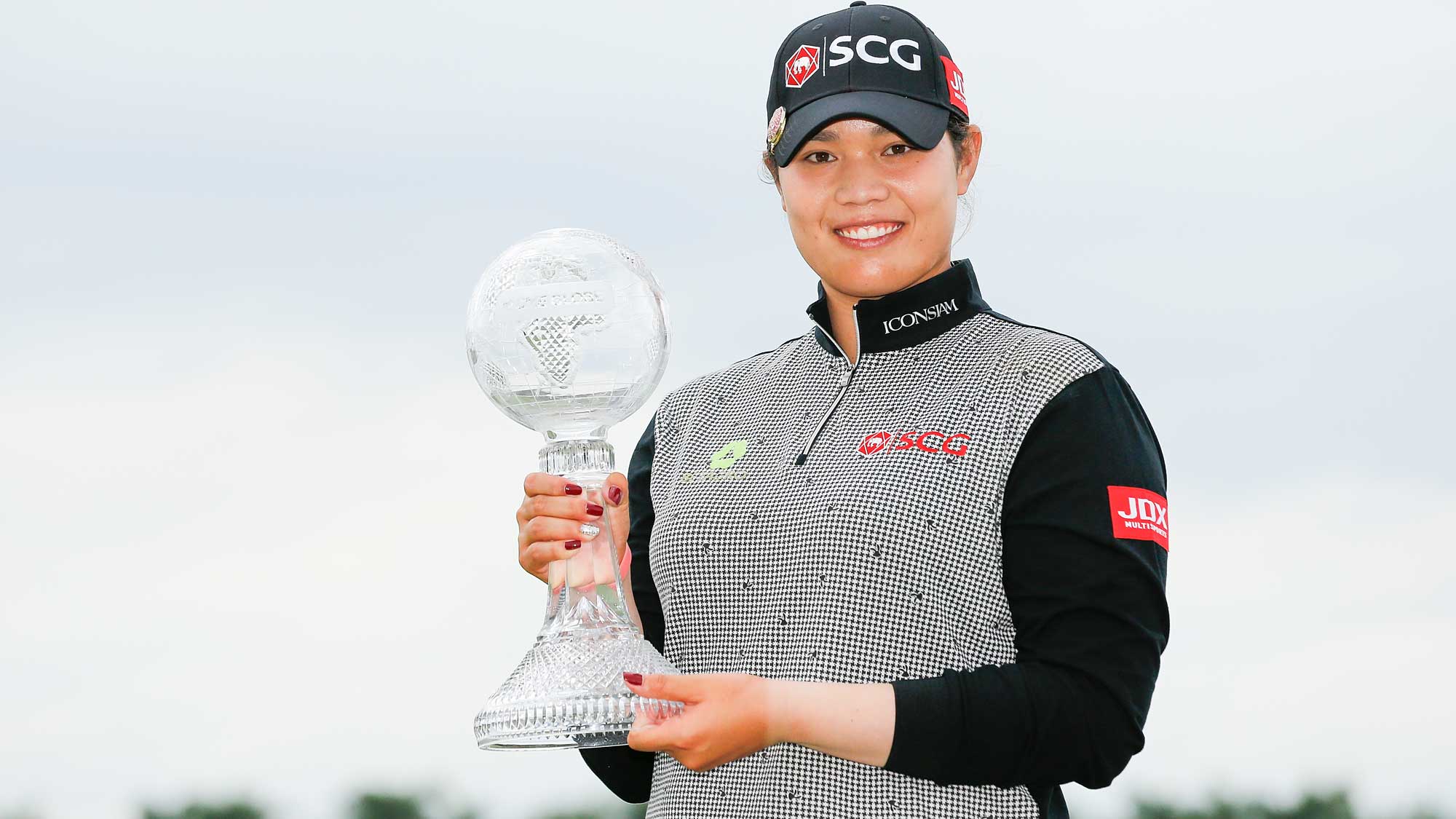 Ariya Jutanugarn of Thailand poses for a photo with the Race to the CME Globe trophy after the final round of the LPGA CME Group Tour Championship