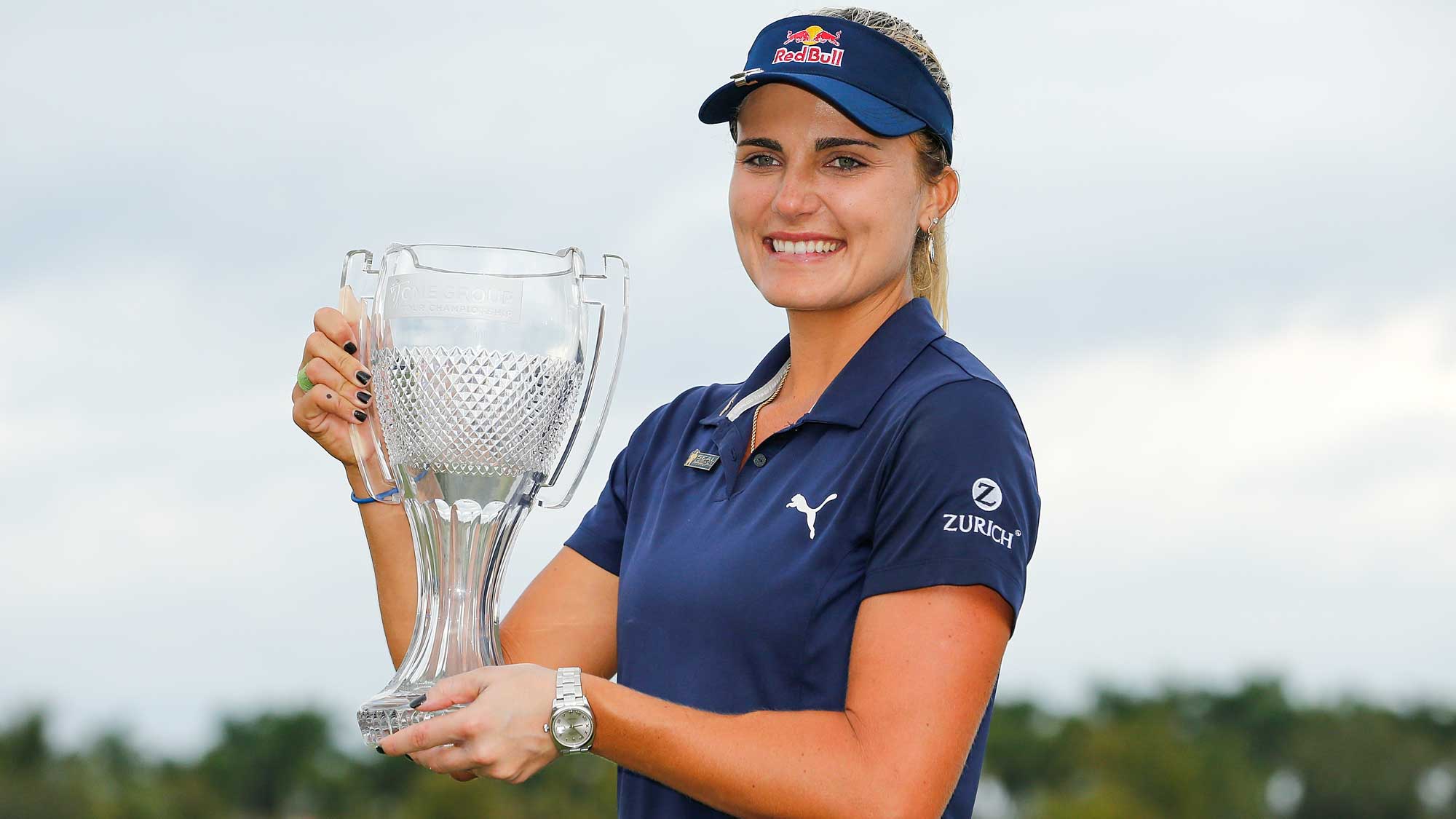 Lexi Thompson poses for a photo with the CME Group Tour Championship trophy