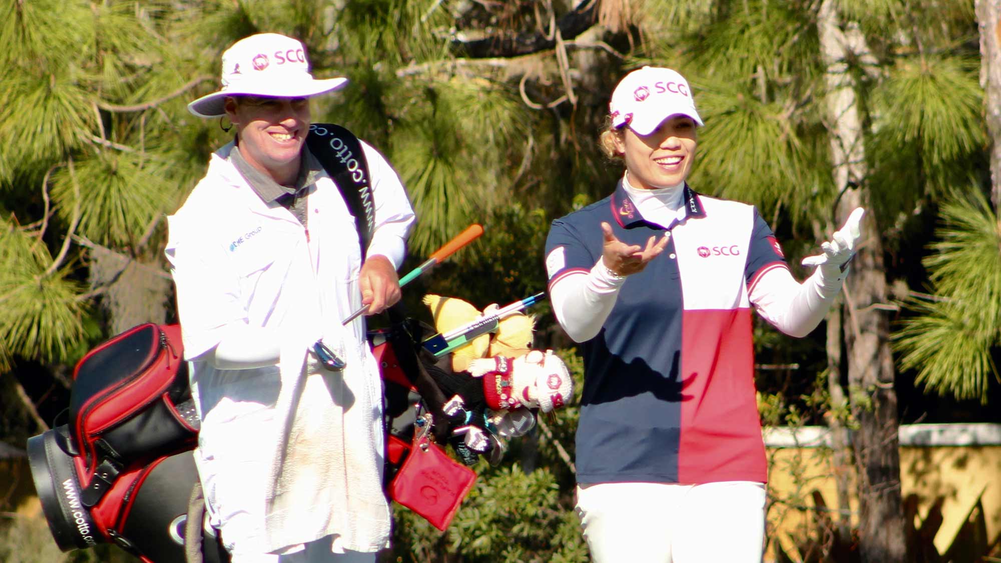 Ariya Jutanugarn and her caddie Peter Godfrey walk together during the third round of the 2019 CME Group Tour Championship