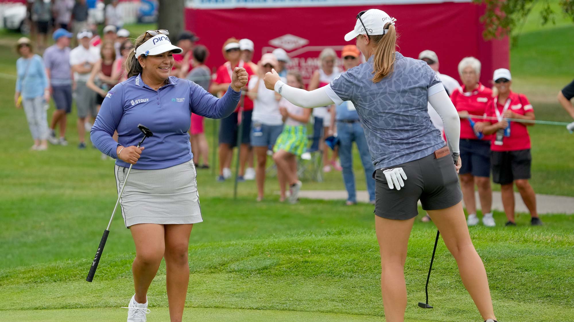  Lizette Salas of the United States (L) and Jennifer Kupcho of the United States celebrate after making birdie on the 17th green during the third round of the Dow Great Lakes Bay Invitational
