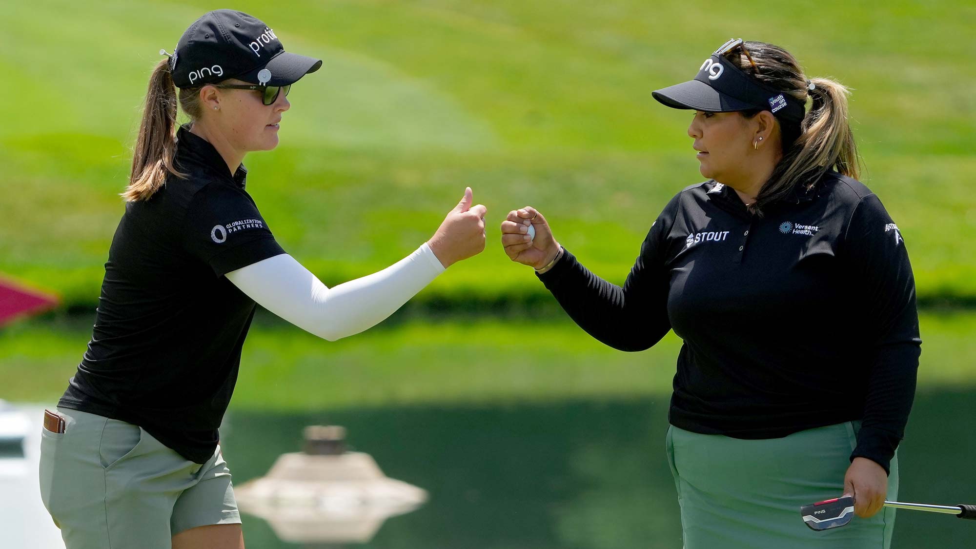 ennifer Kupcho of the United States (L) and Lizette Salas of the United States celebrate after making birdie on the fifth green during the final round of the Dow Great Lakes Bay Invitational