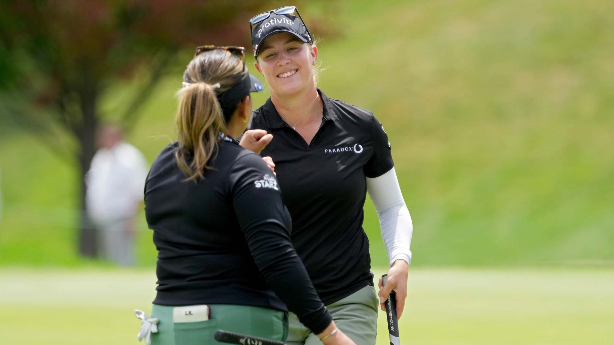Lizette Salas of the United States (L) and Jennifer Kupcho of the United States celebrate after making birdie on the seventh green during the final round of the Dow Great Lakes Bay Invitational 