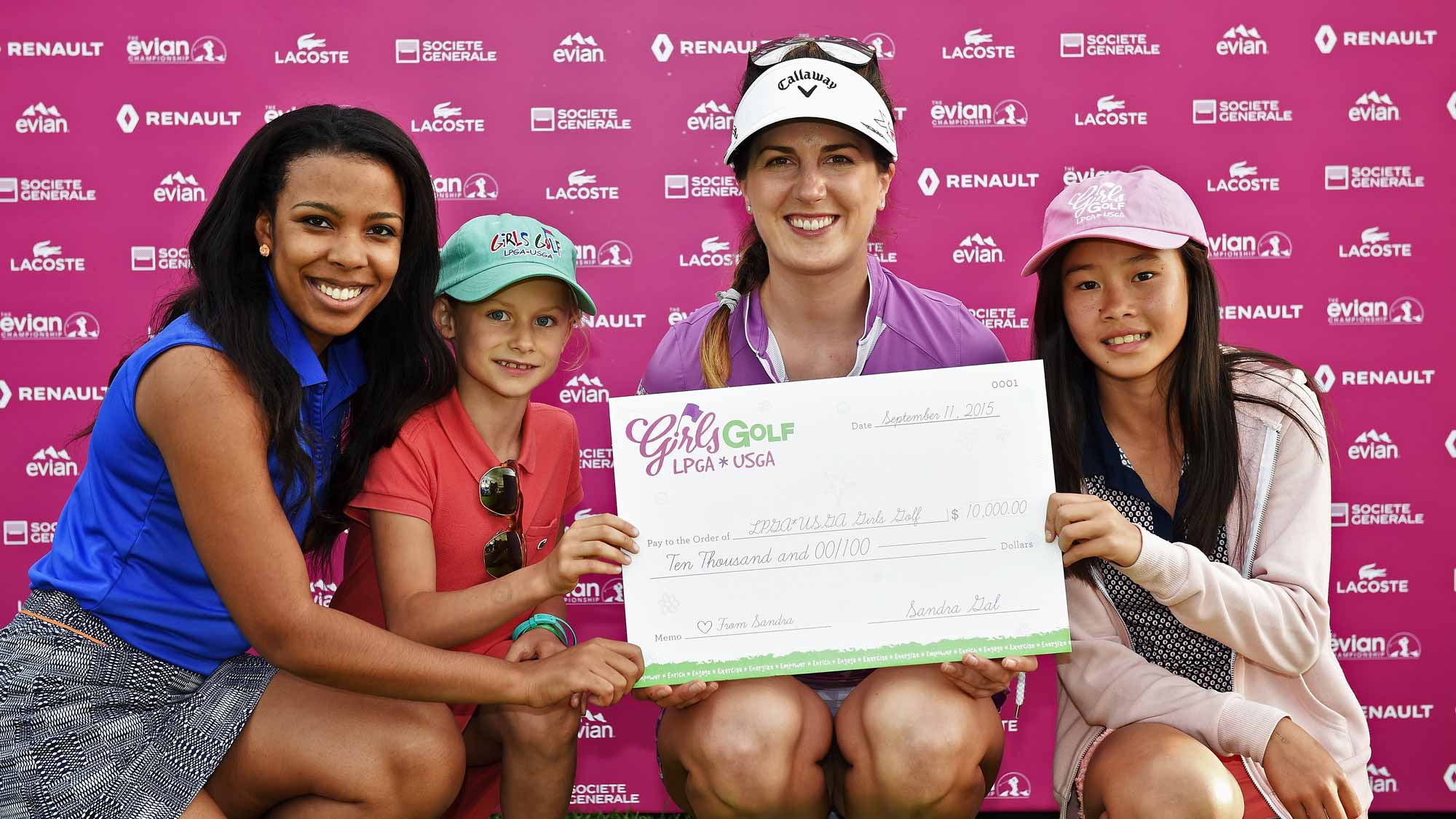 Sandra Gal presents a check for $10,000 to LPGA Girls Golf during the second round of the Evian Championship 